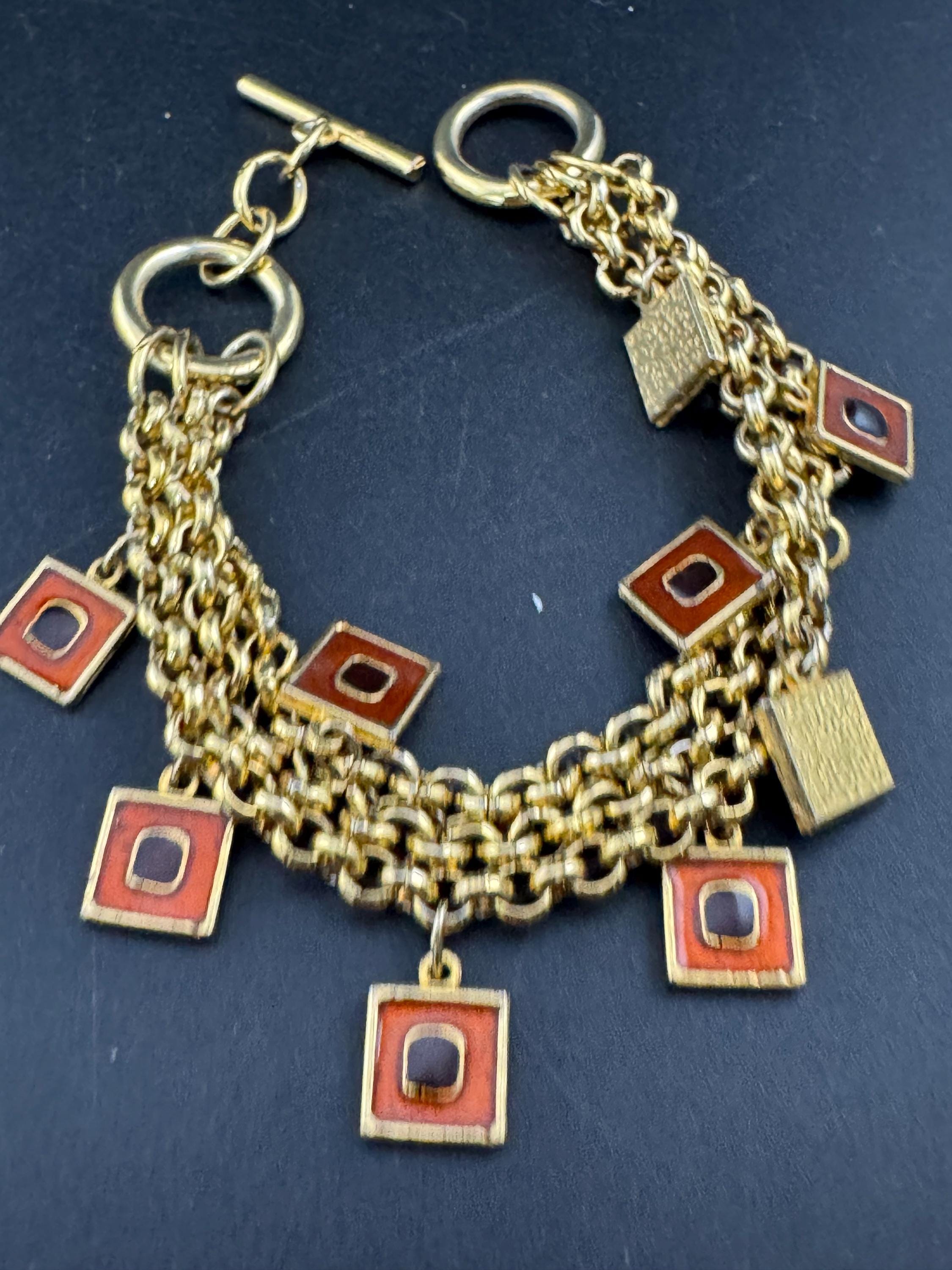 Vintage high end orange and black enamel chain link statement Multistrand charm bracelet gold tone unsigned