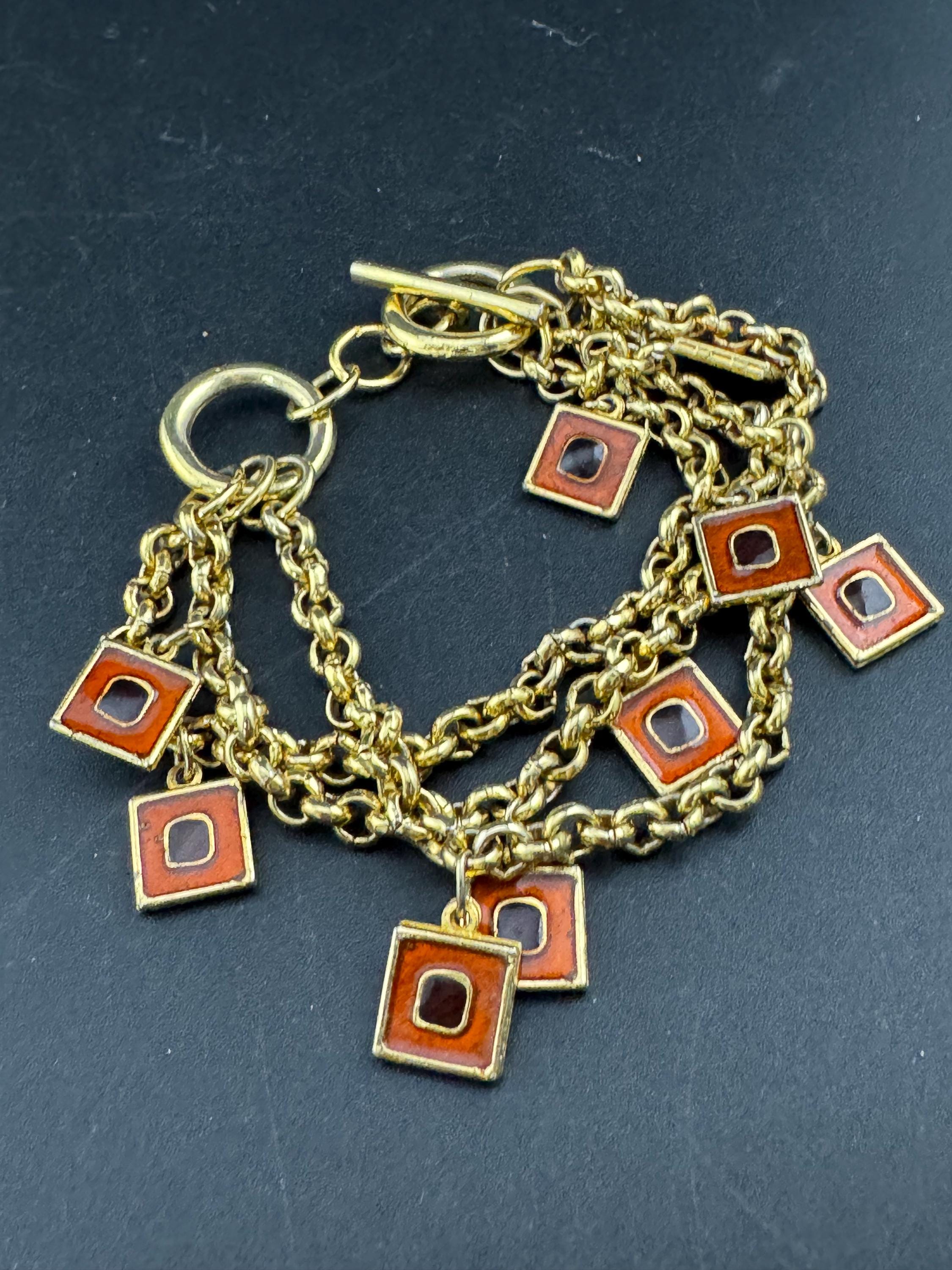Vintage high end orange and black enamel chain link statement Multistrand charm bracelet gold tone unsigned