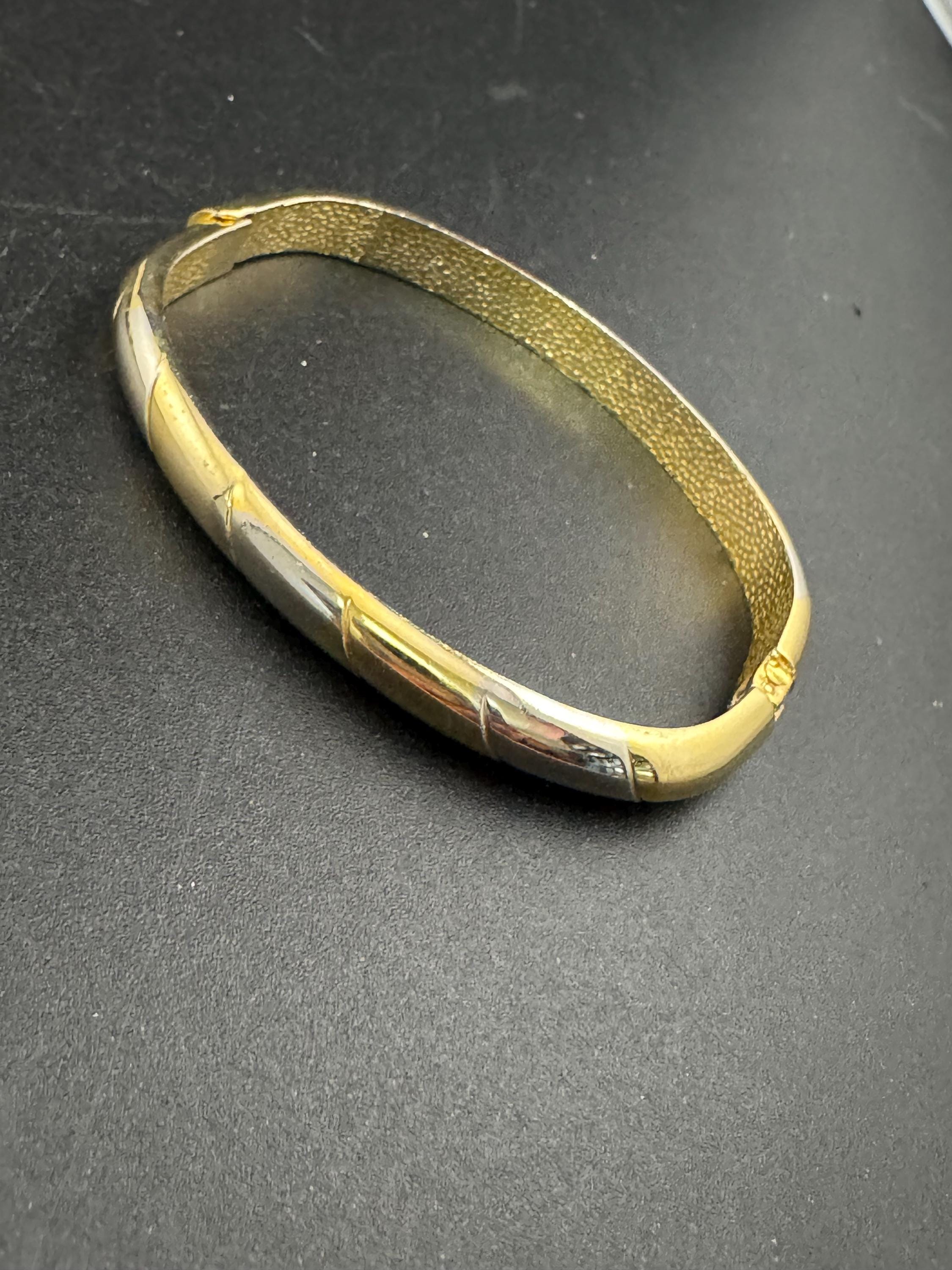 Vintage slim silver and gold tone striped hinged bangle bracelet