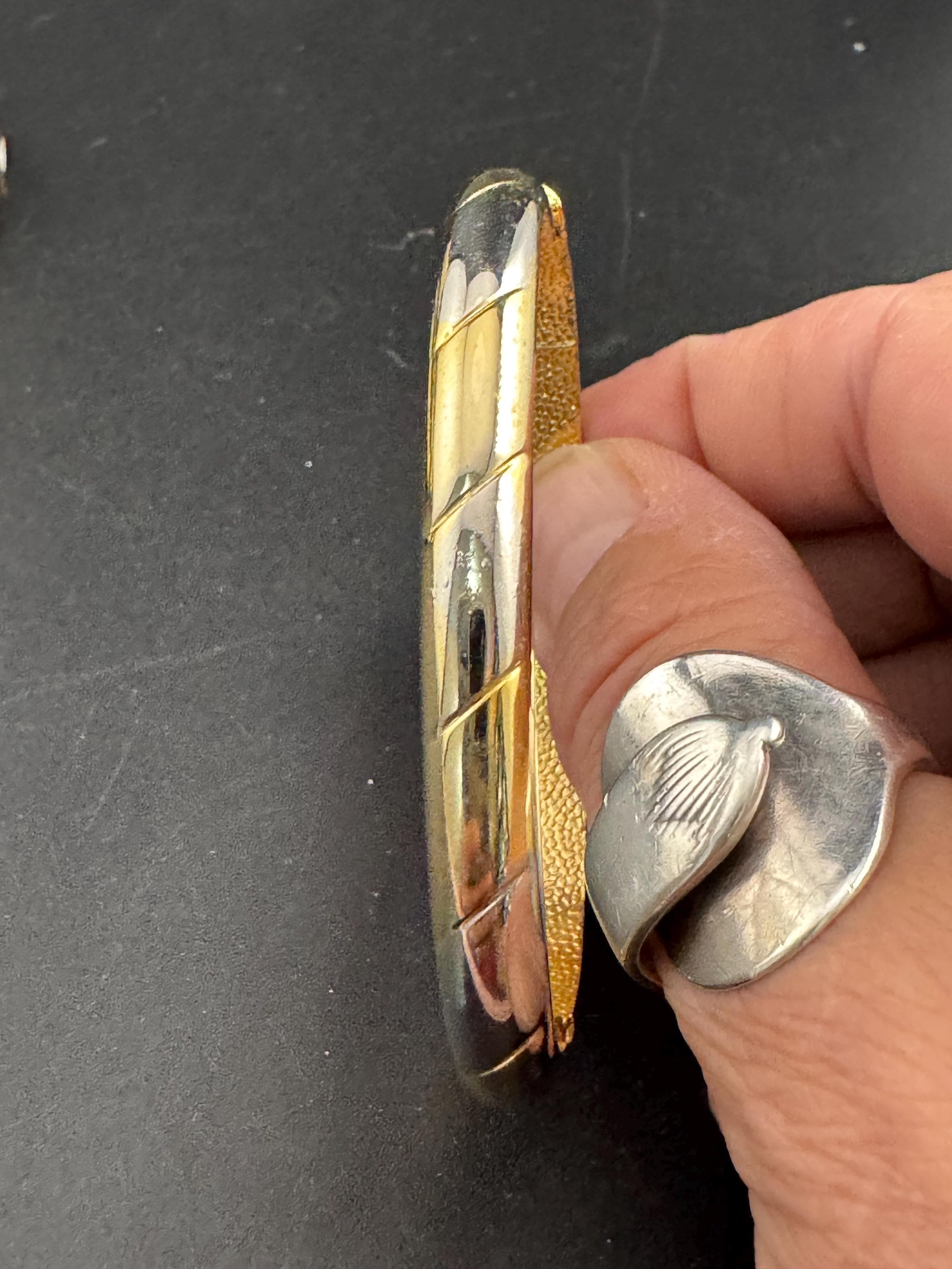 Vintage slim silver and gold tone striped hinged bangle bracelet