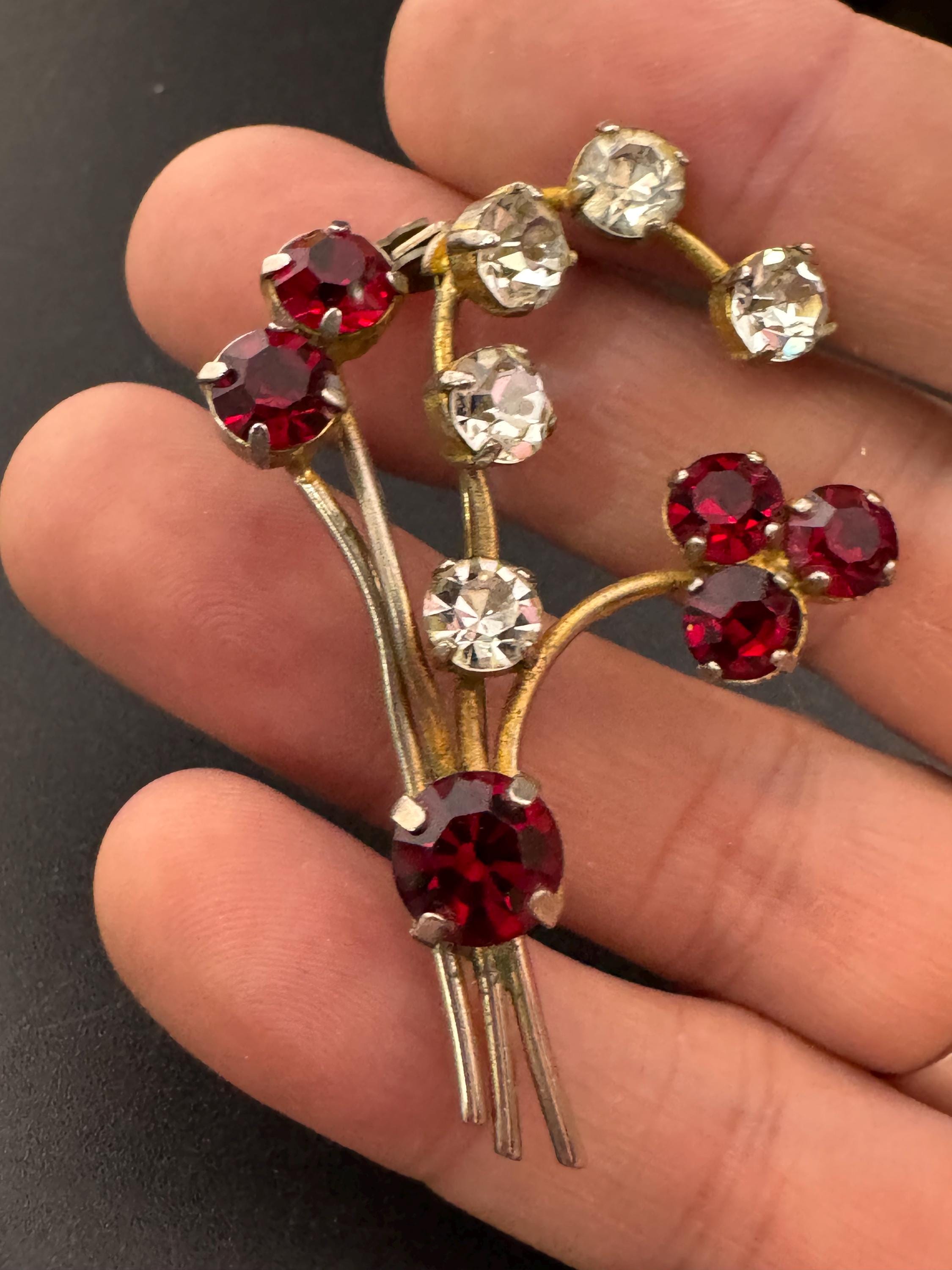 Vintage ruby red glass rhinestone gold tone floral brooch , mid century