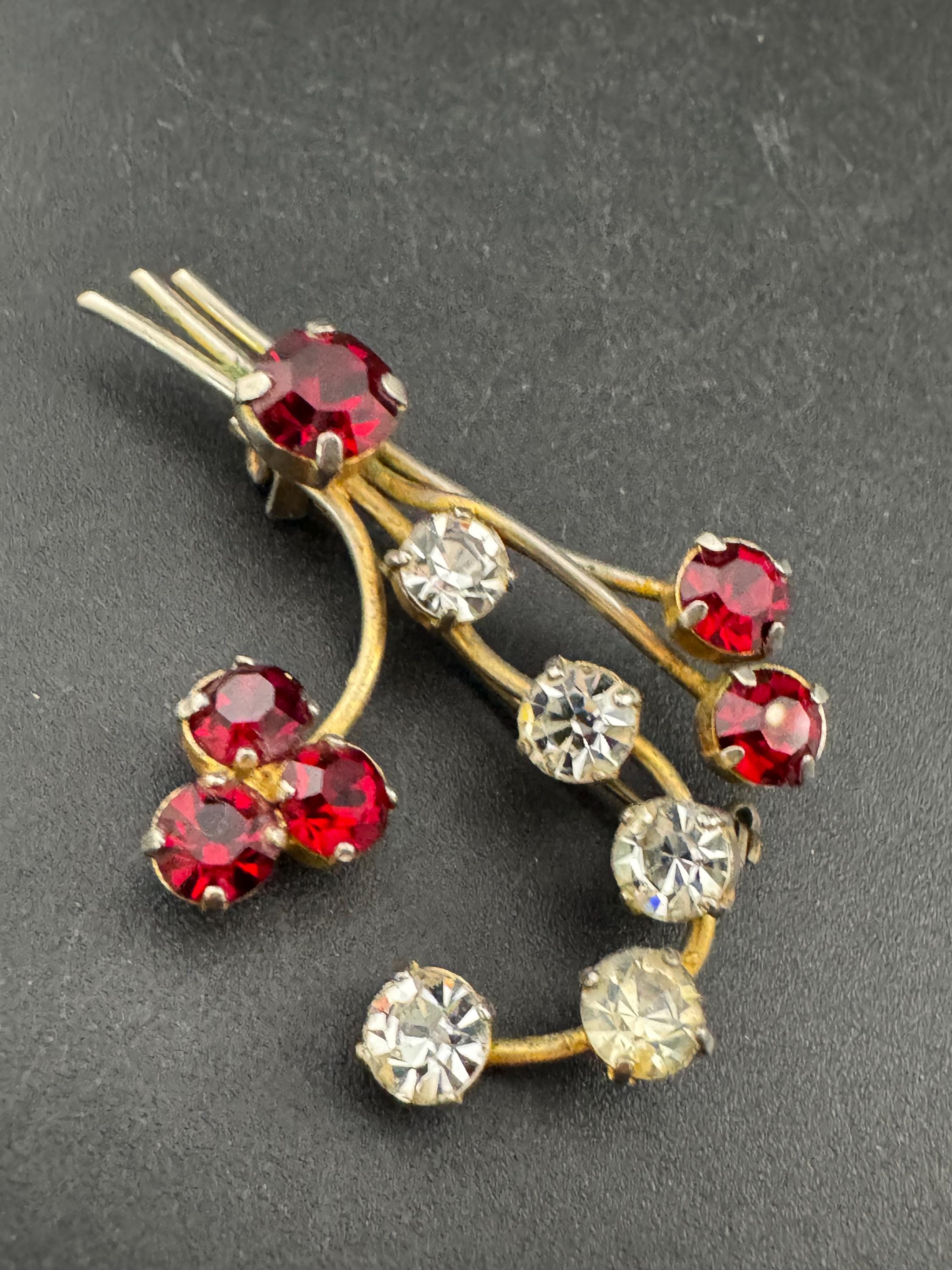 Vintage ruby red glass rhinestone gold tone floral brooch , mid century