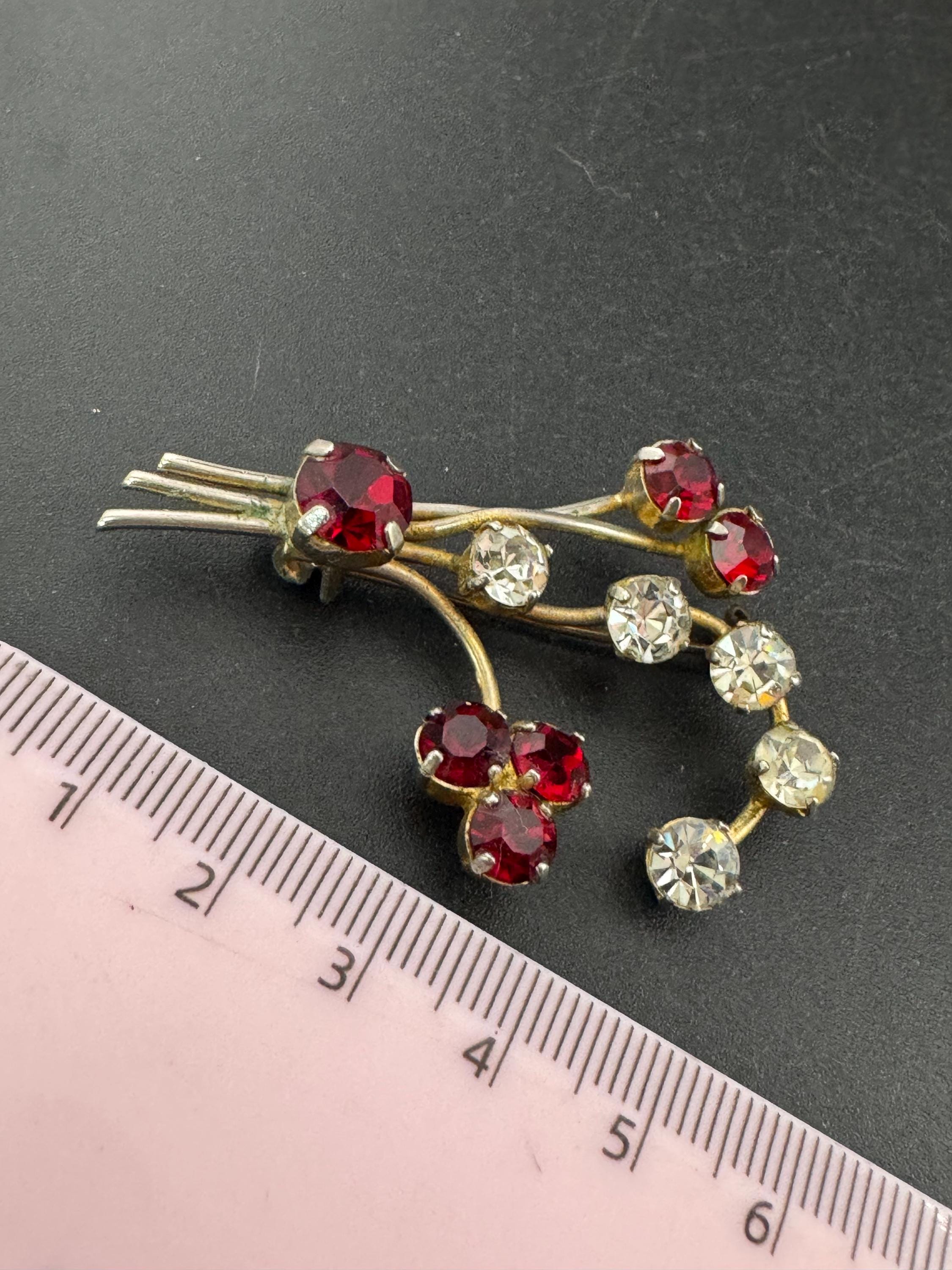 Vintage ruby red glass rhinestone gold tone floral brooch , mid century