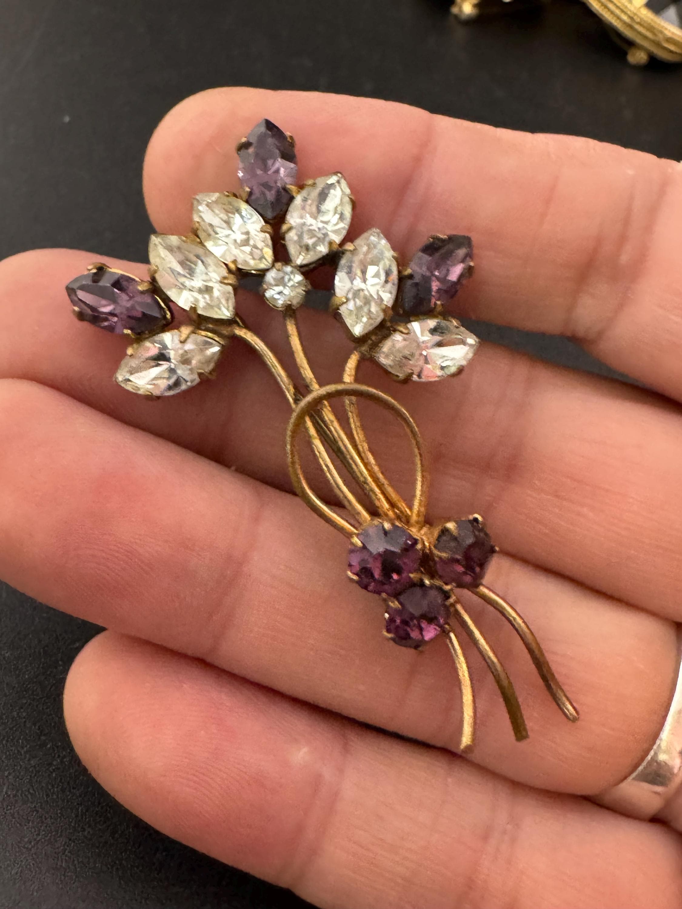 Vintage dainty amethyst purple glass rhinestone gold tone floral brooch , mid century
