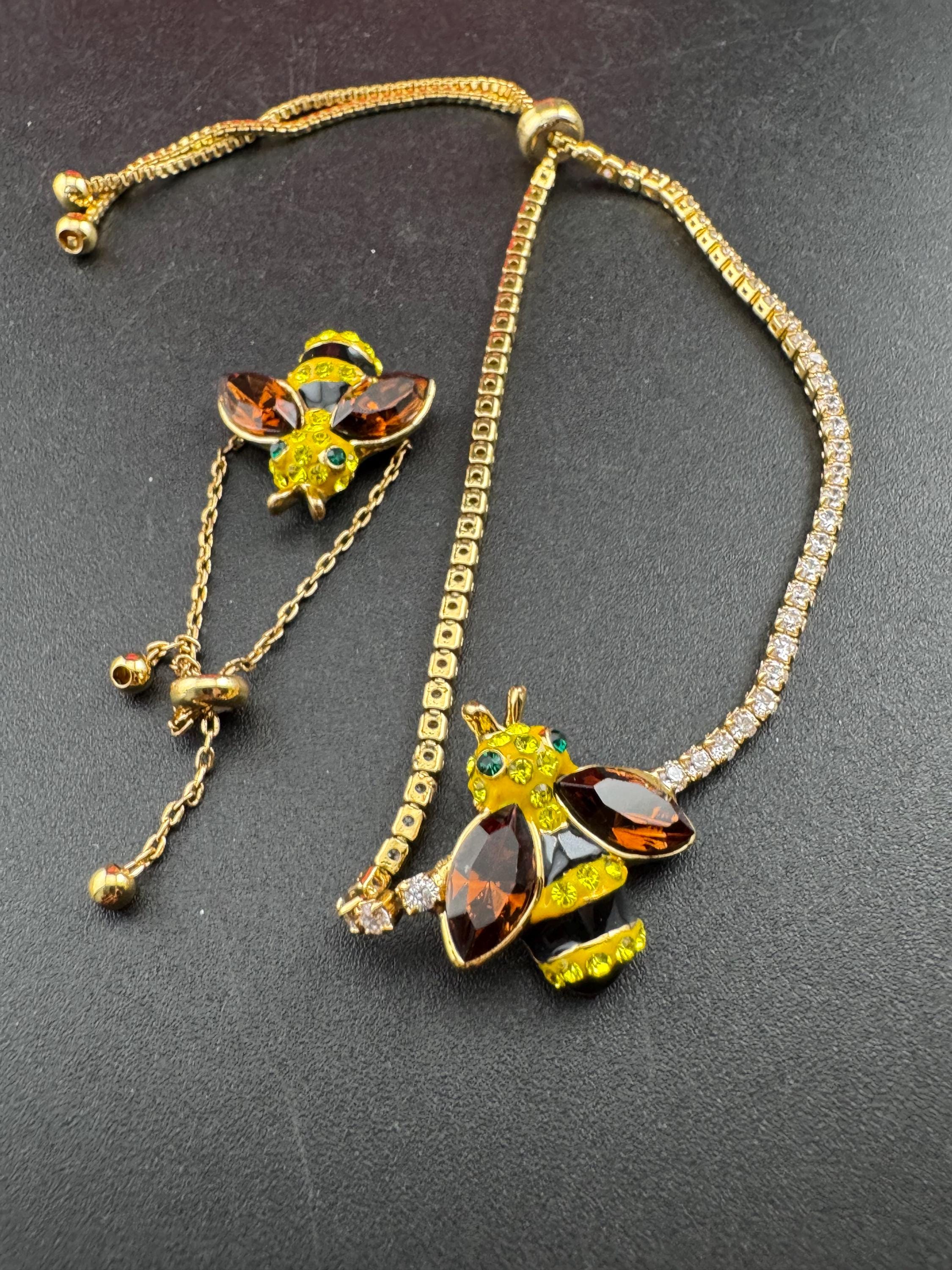 Signed butler and Wilson gold tone bumble bee jewellery set , tennis bracelet and adjustable dress ring , boxed,