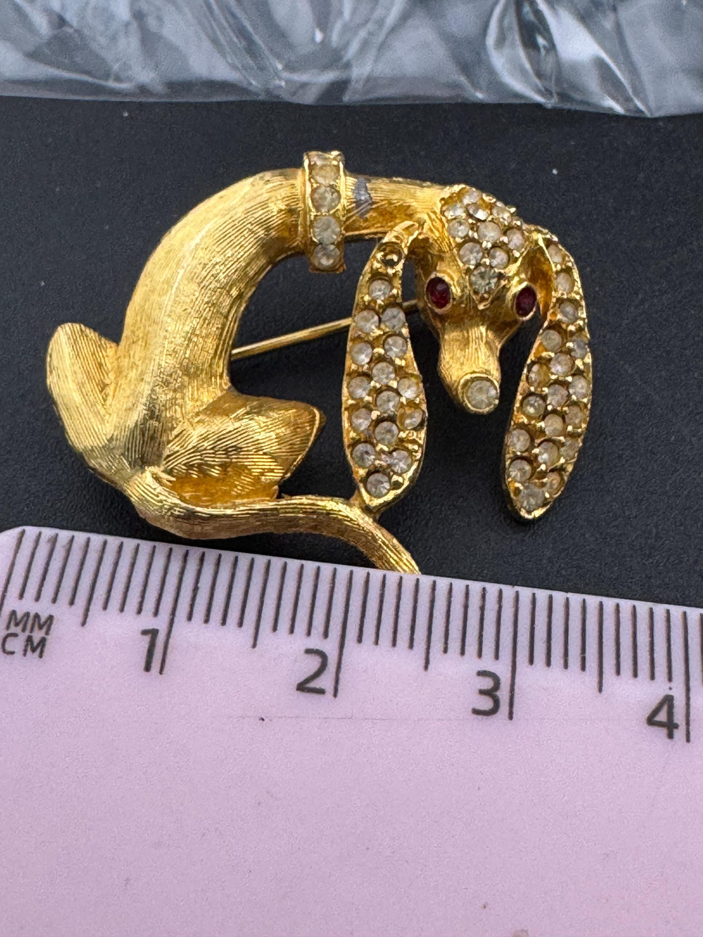 Mid century Dachshund sausage dog rhinestone brooch, Gold tone