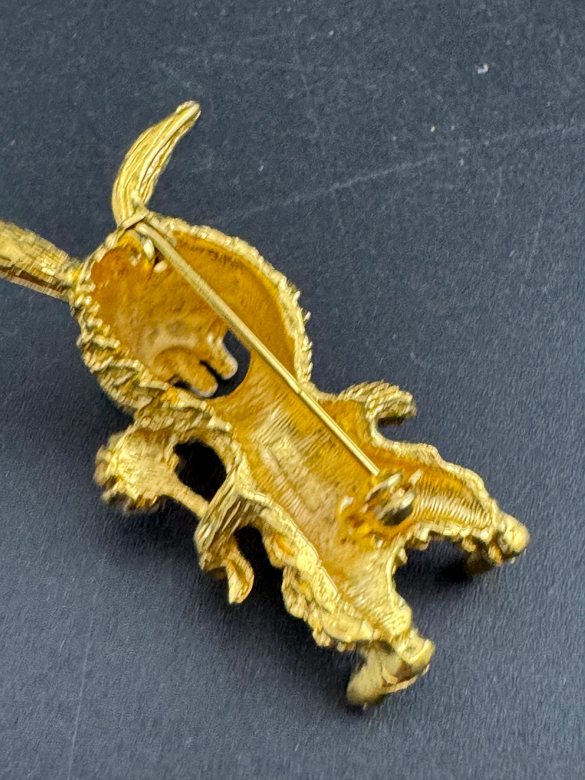 Novelty rabbit brooch, gold tone and emerald rhinestone