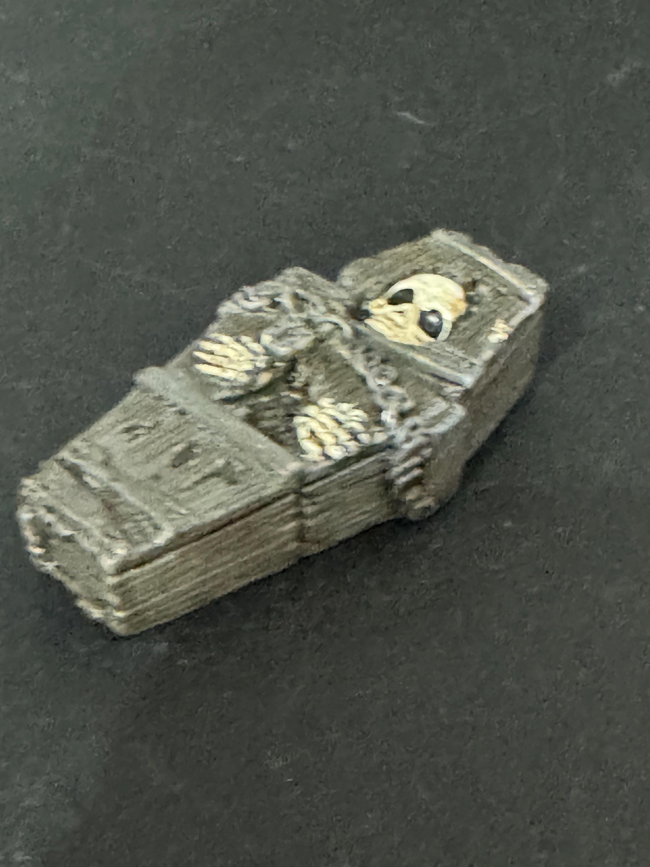 Miniature spooky Halloween skeleton in a coffin cake topper decorations, craft scenery, reusable plastic