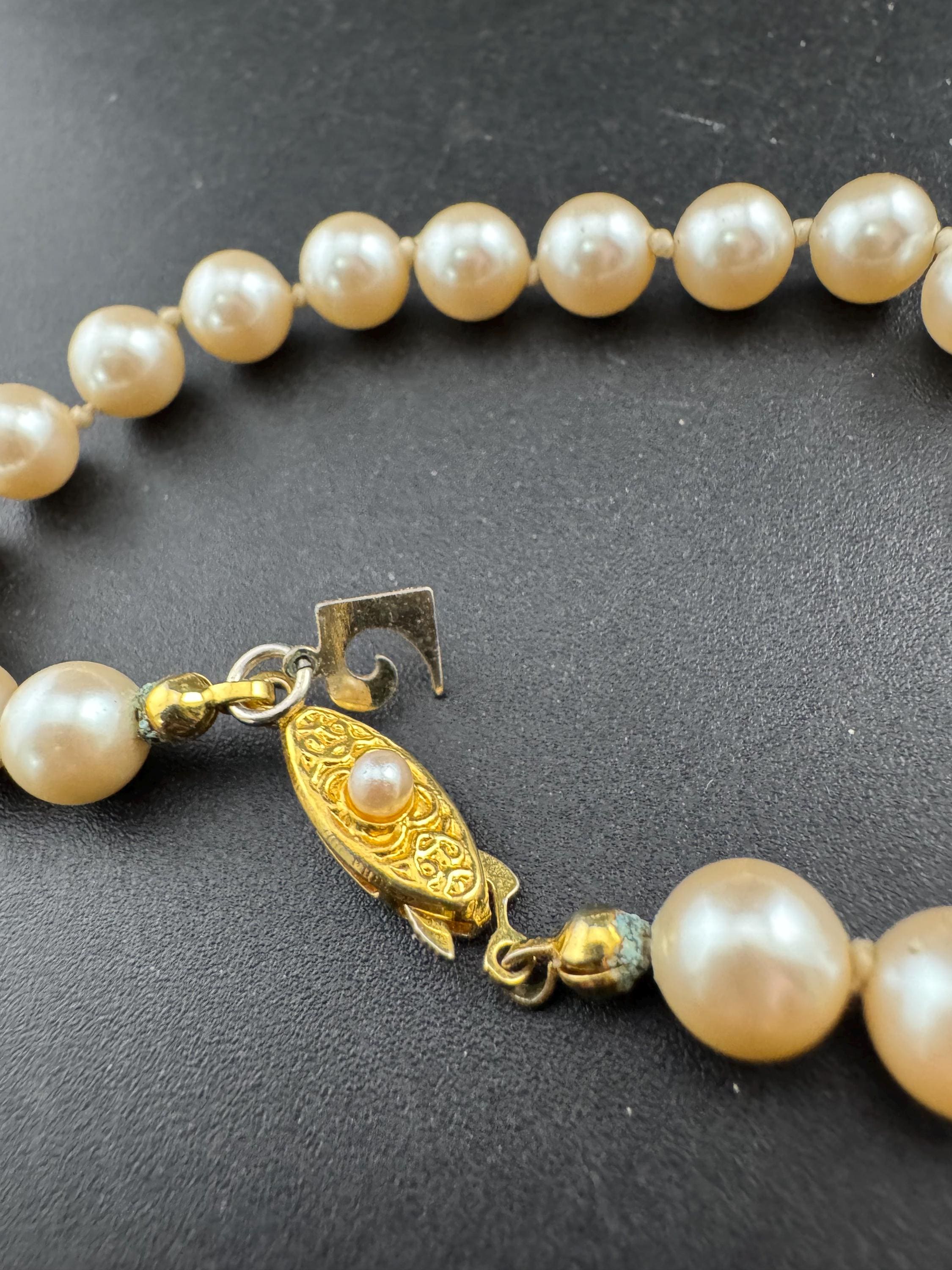 Signed Pierre Cardin Classic ivory glass pearl collar necklace, individually knotted beads 42cm gold tone