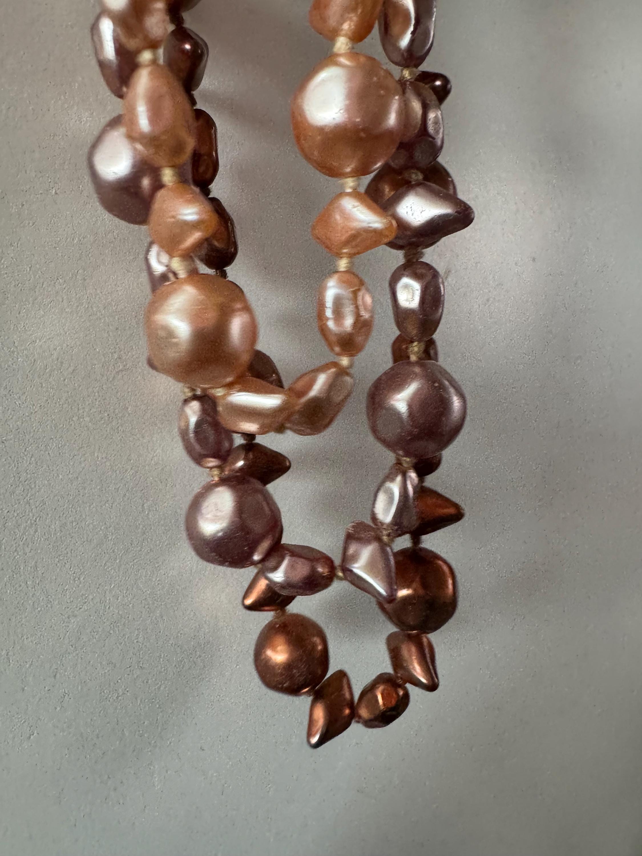 Fantastic Vintage triple strand row brown pink bronze glass faux pearl beaded multistrand necklace with a huge glass cabochon clasp
