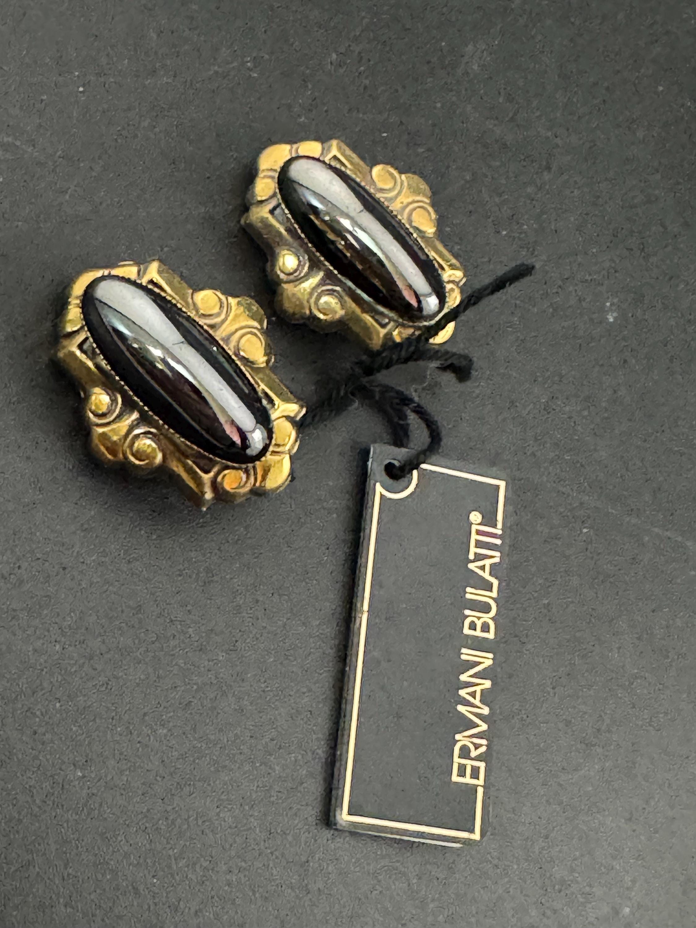 Designer Ermani Bulatti grey glass oval clip on earrings, antique gold tone signed