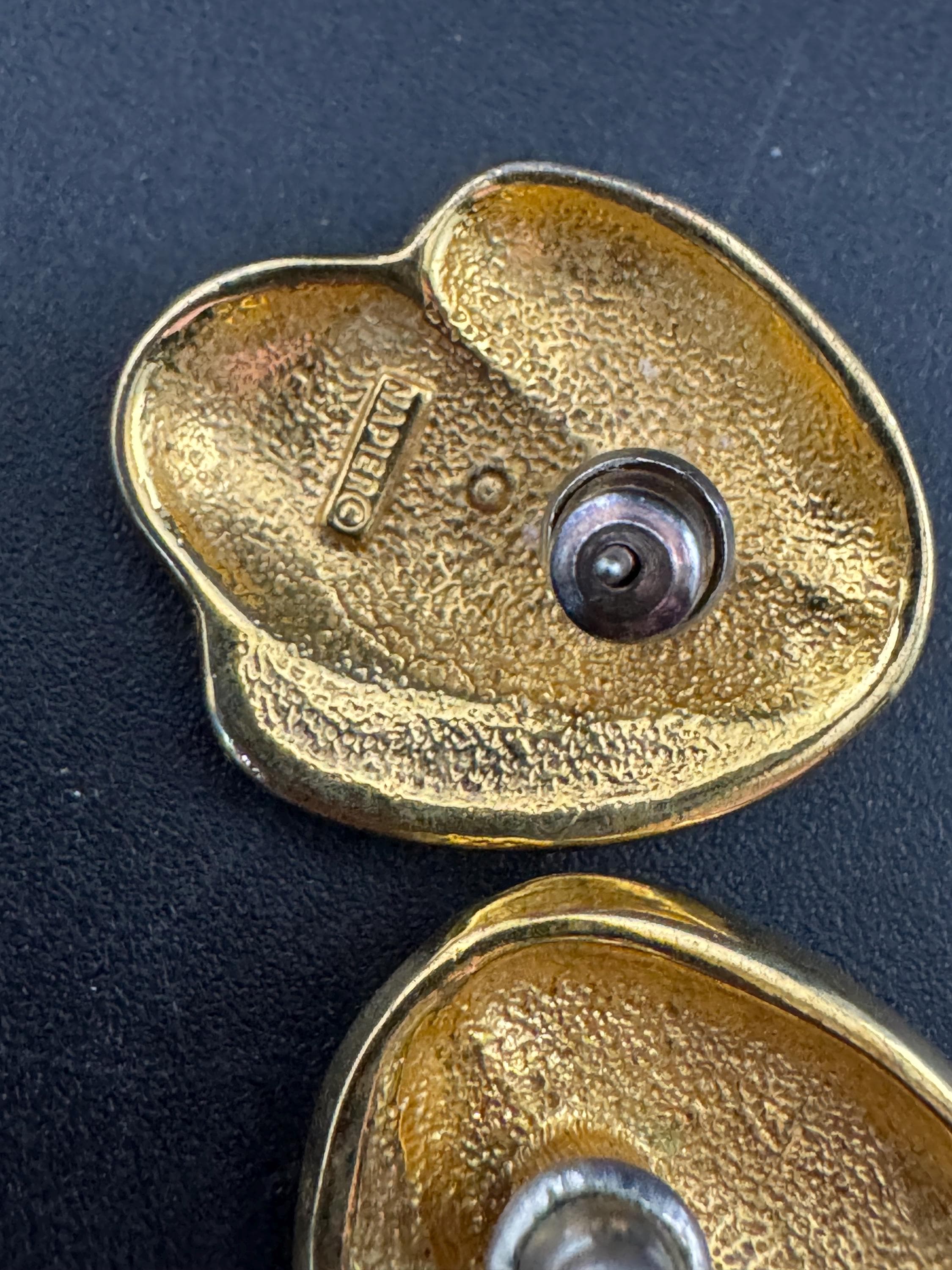 Signed Napier cream enamel pair stud earrings, gold tone pierced