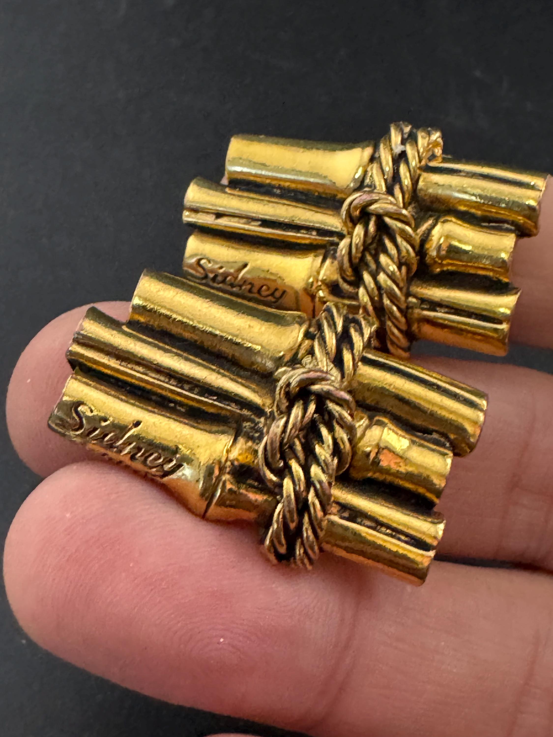Signed Sidney carron rope twist clip on earrings, designer gold tone