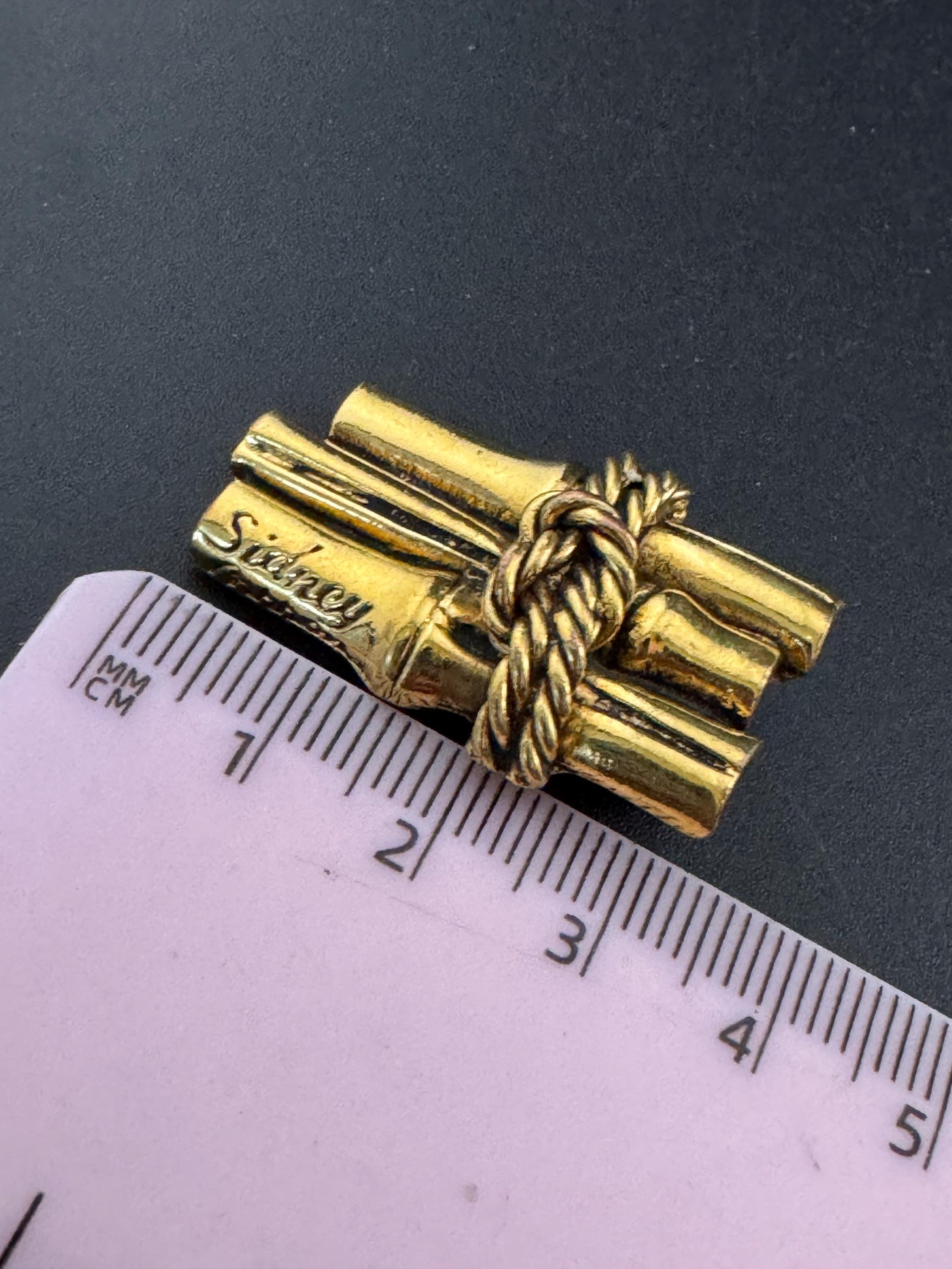 Signed Sidney carron rope twist clip on earrings, designer gold tone
