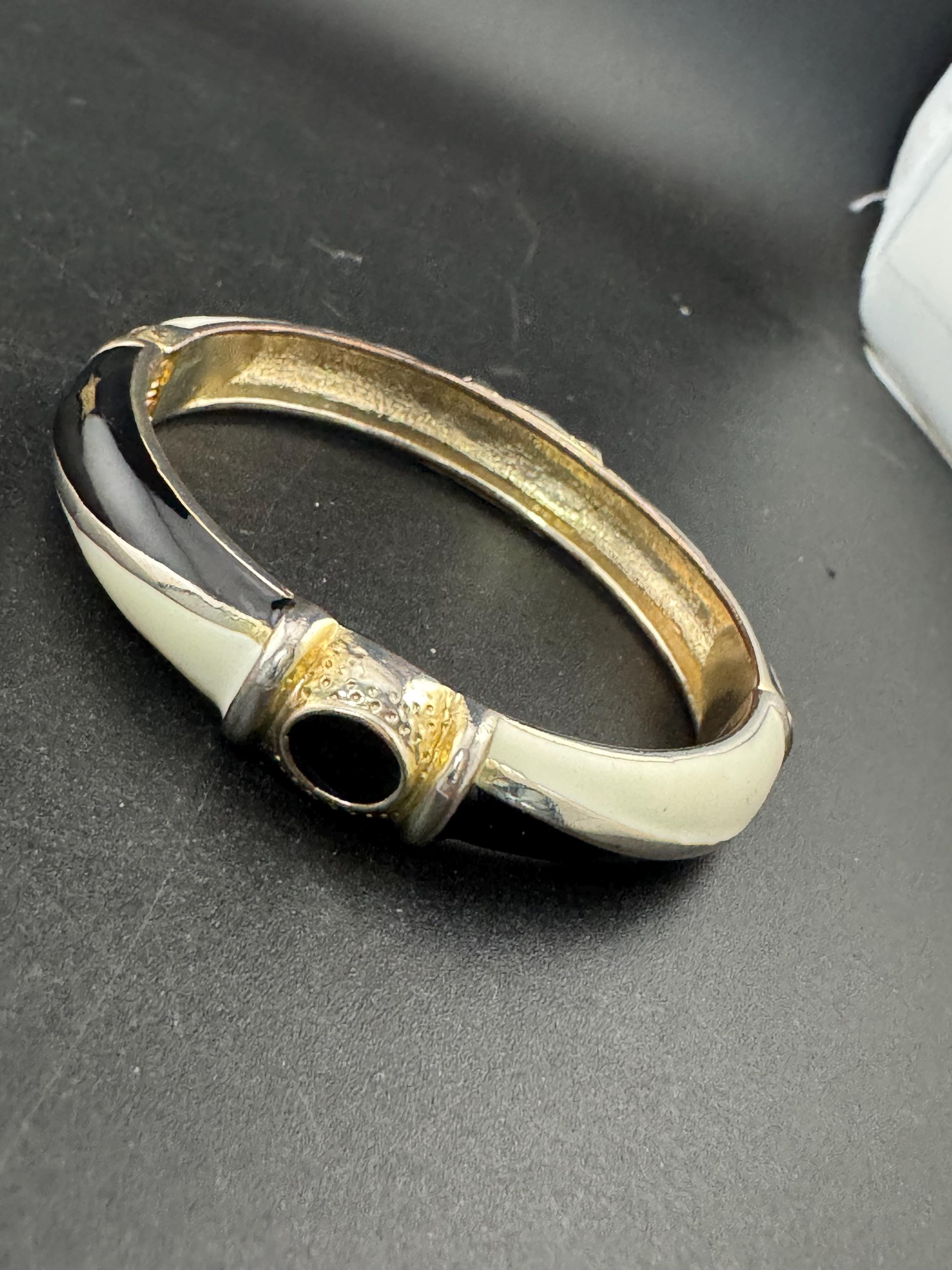 Vintage cream and black enamel hinged clamper bangle , 80s