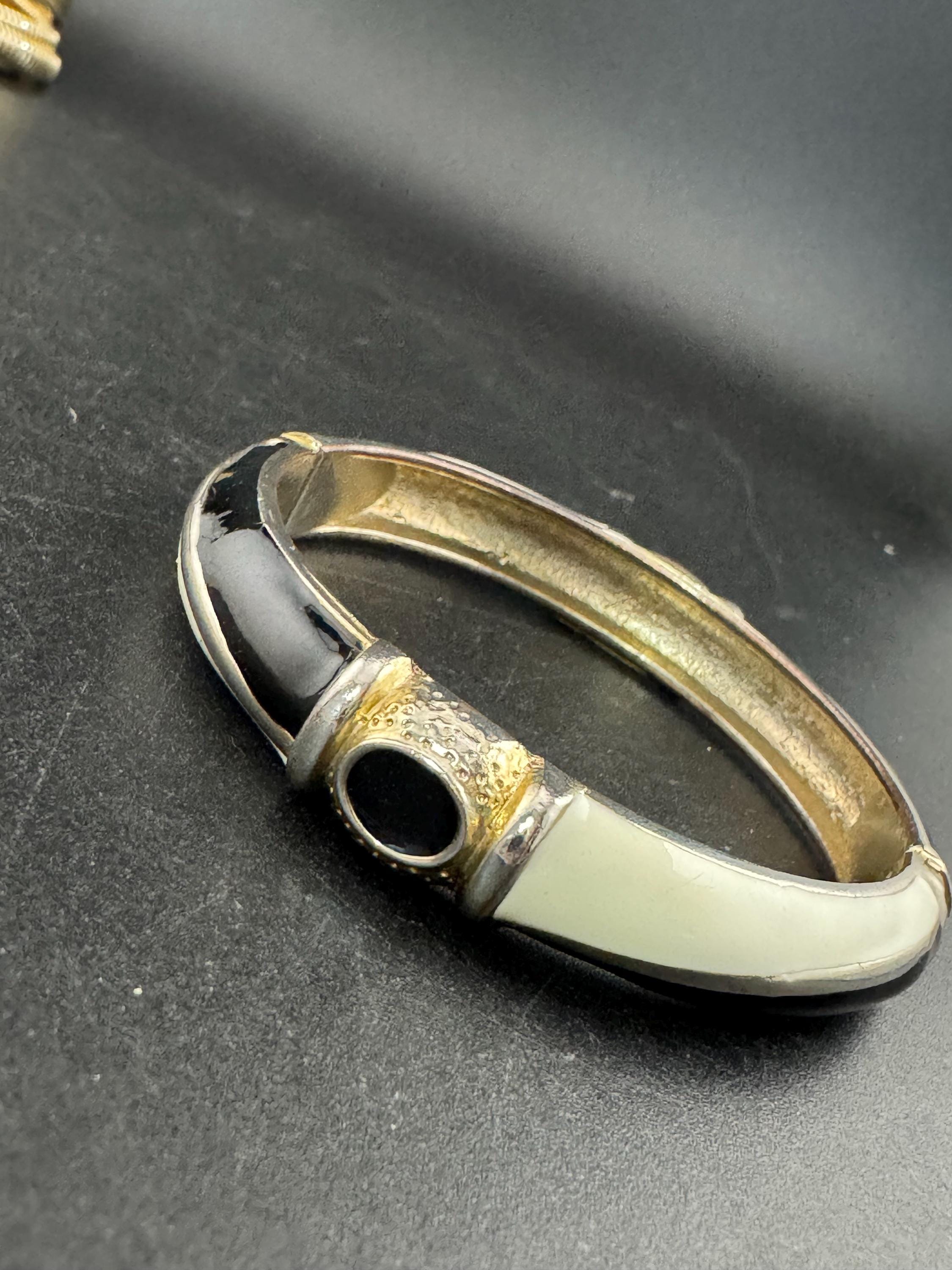 Vintage cream and black enamel hinged clamper bangle , 80s