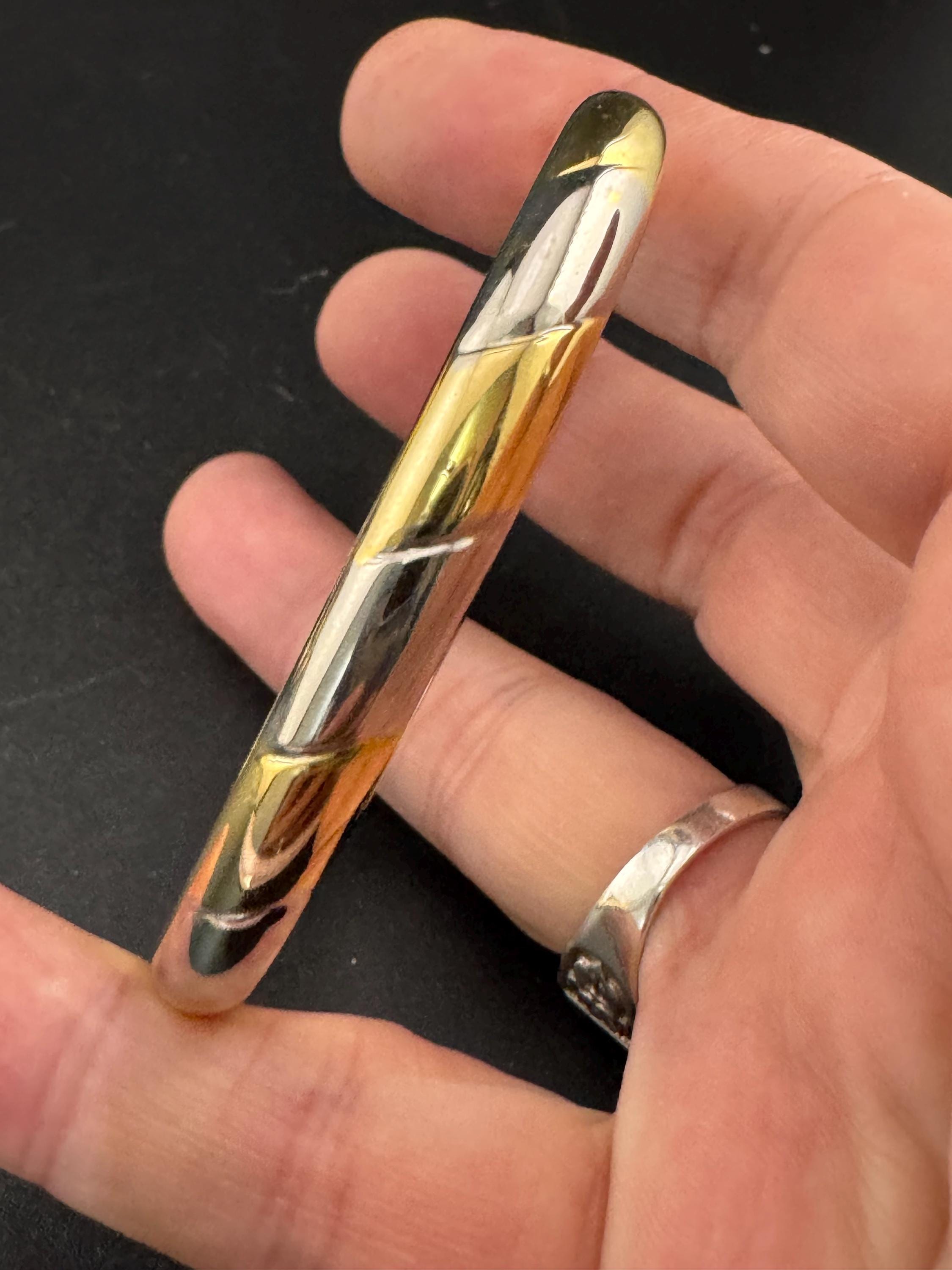 Vintage slim silver and gold tone striped hinged bangle bracelet