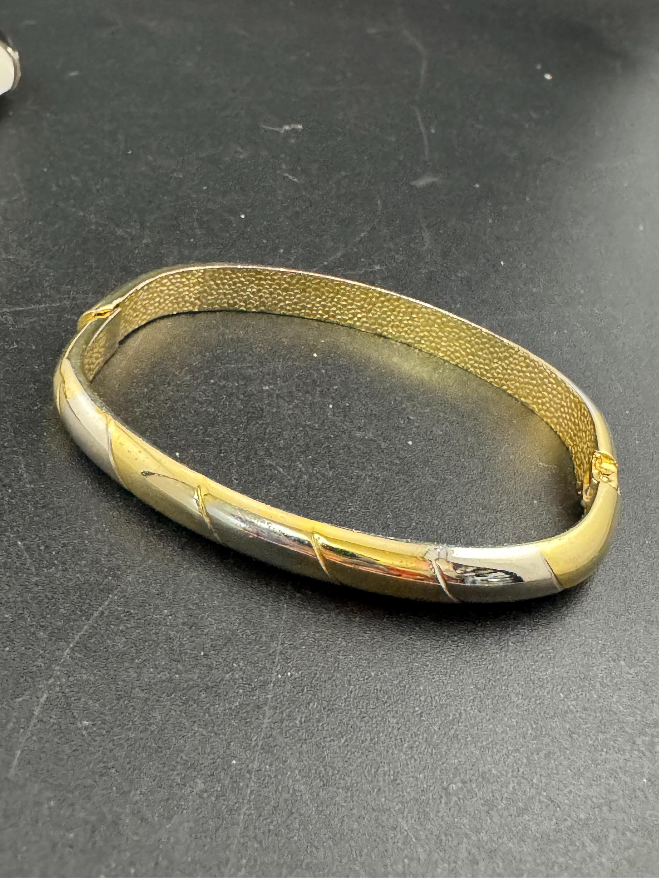 Vintage slim silver and gold tone striped hinged bangle bracelet