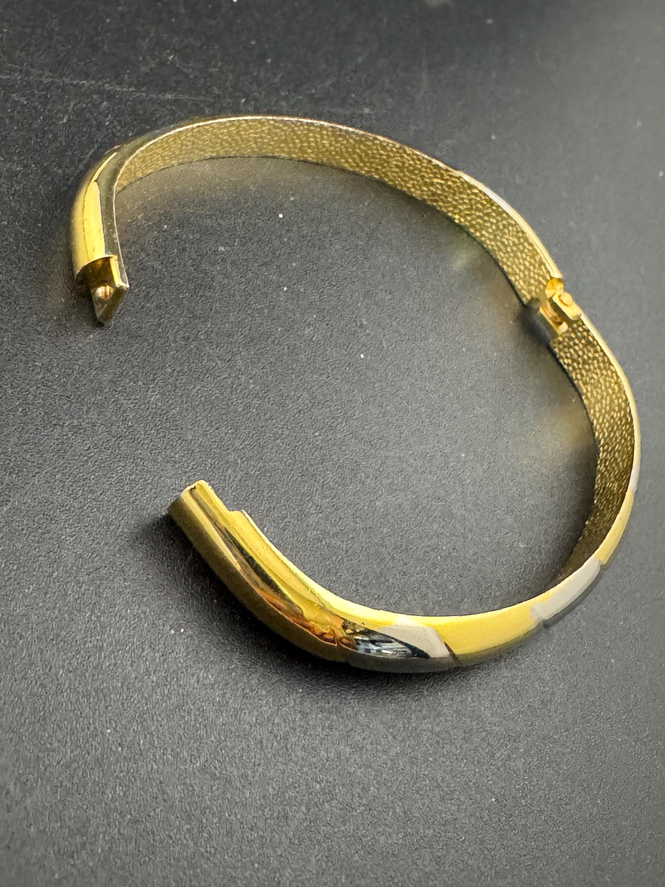 Vintage slim silver and gold tone striped hinged bangle bracelet