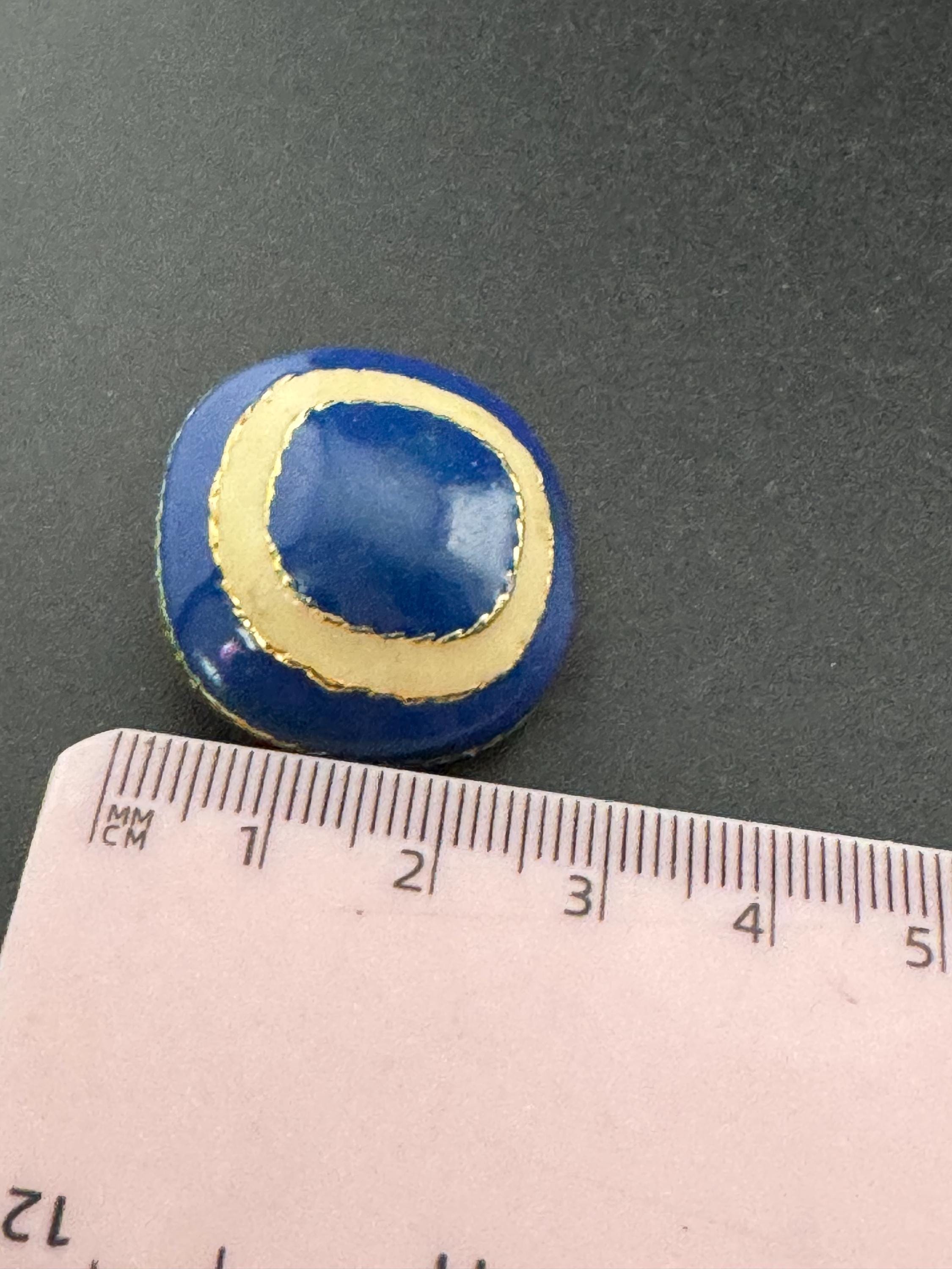 Vintage oversized blue and cream enamel gold tone clip on earrings