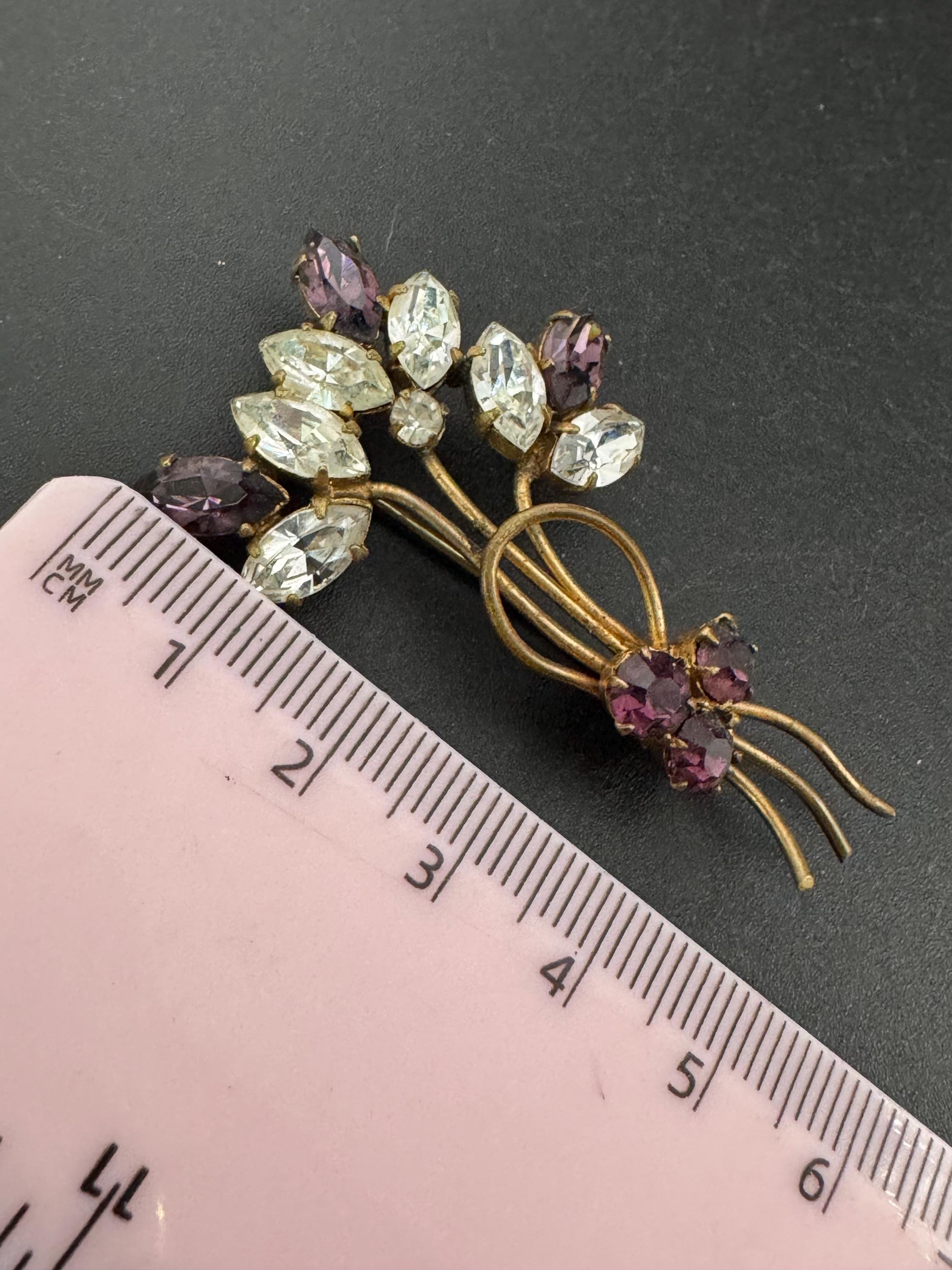 Vintage dainty amethyst purple glass rhinestone gold tone floral brooch , mid century