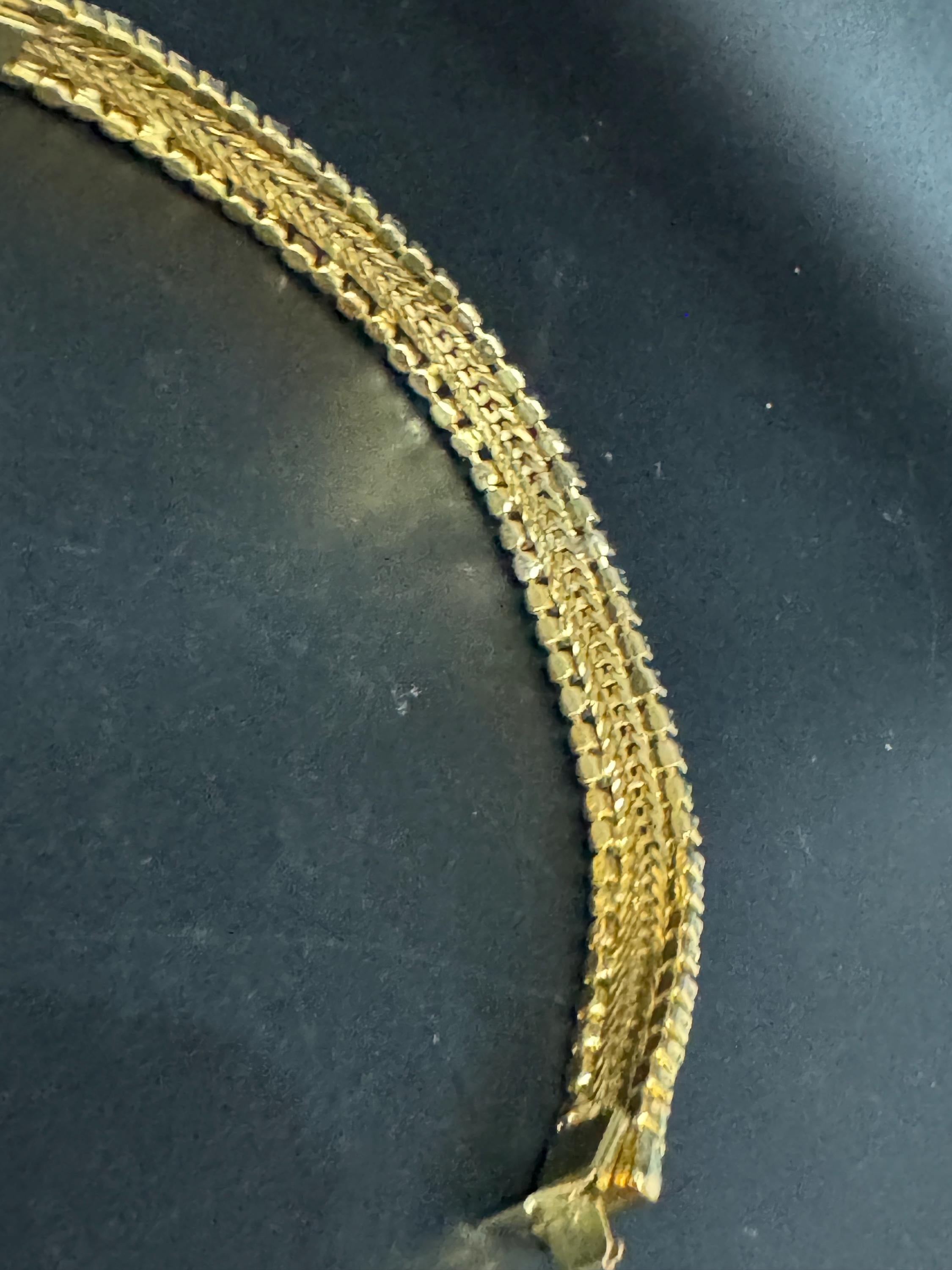 Vintage articulated flat link mesh gold tone bracelet with turquoise blue paste