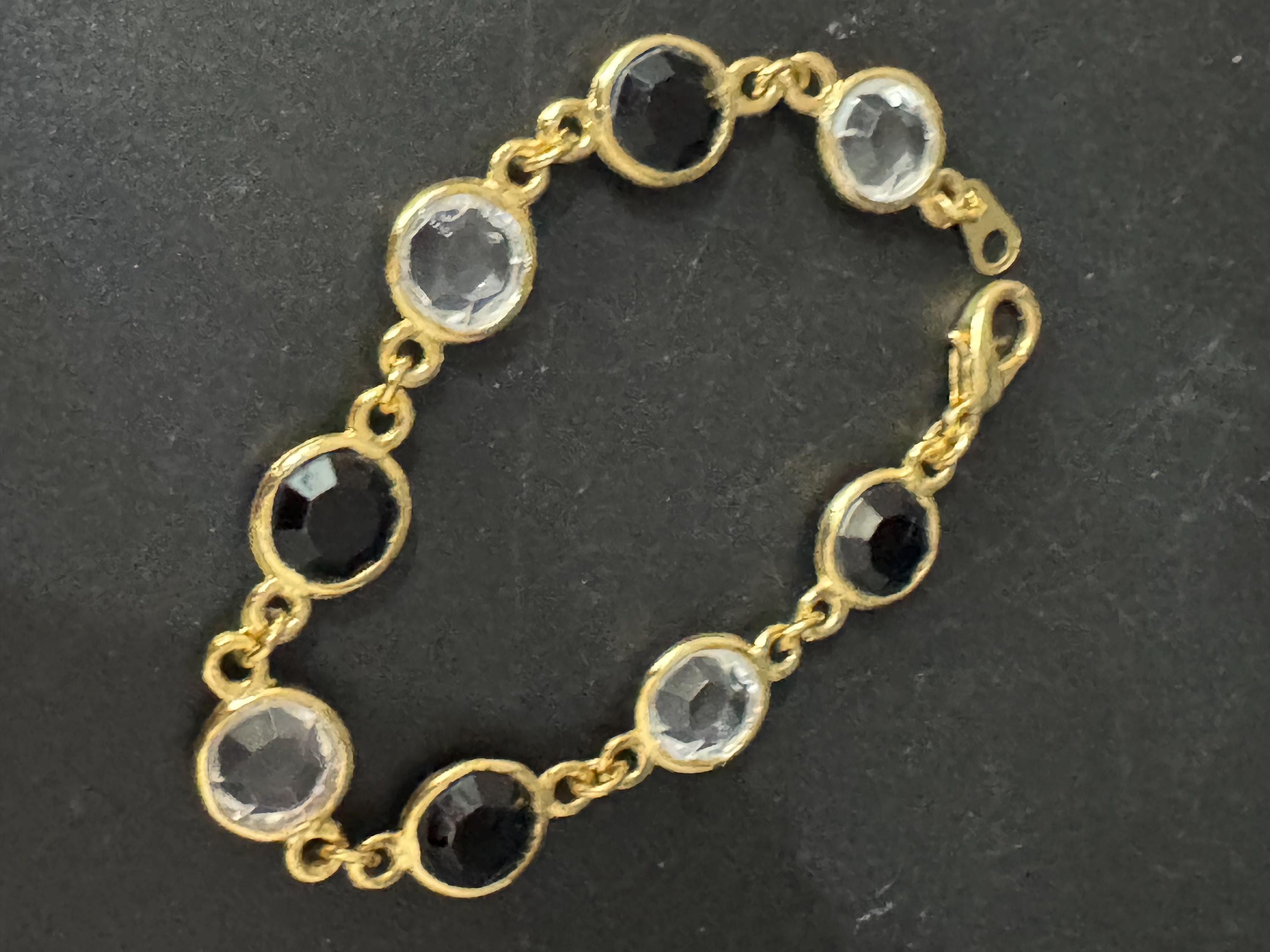 Vintage black and clear round bezel set gold tone open backed rivière bracelet 18.5cm