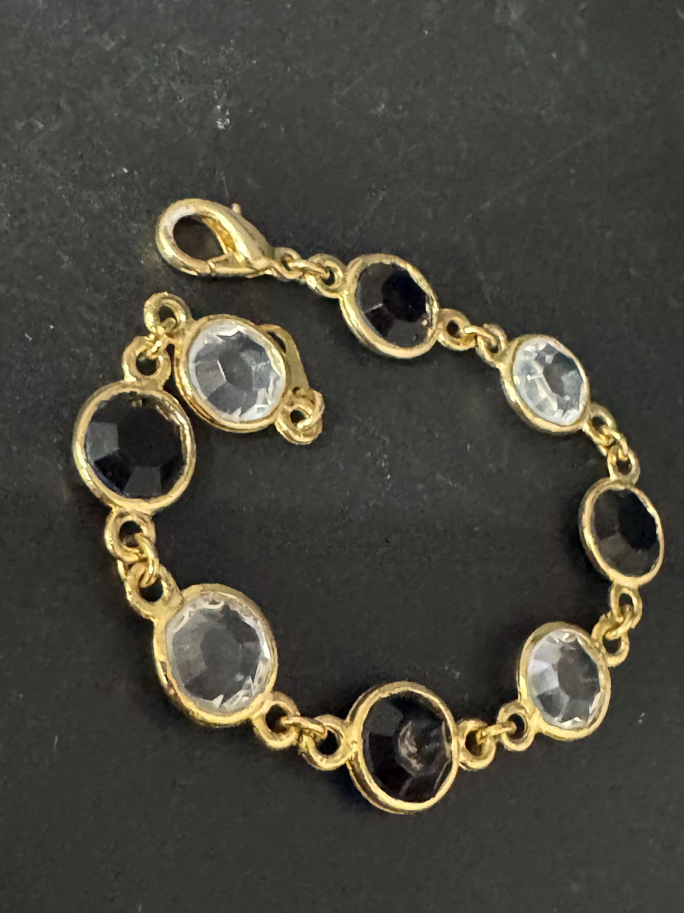 Vintage black and clear round bezel set gold tone open backed rivière bracelet 18.5cm