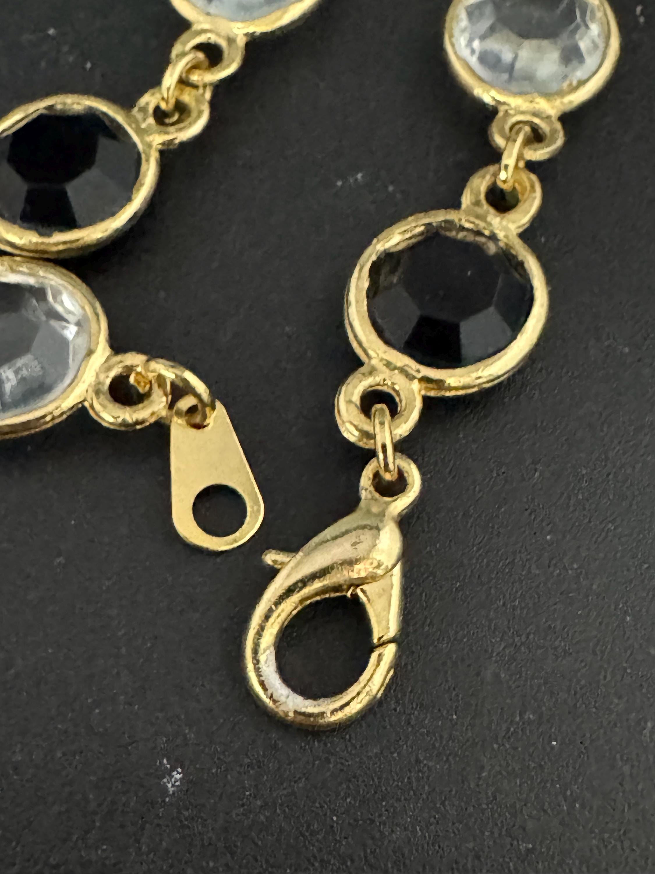 Vintage black and clear round bezel set gold tone open backed rivière bracelet 18.5cm
