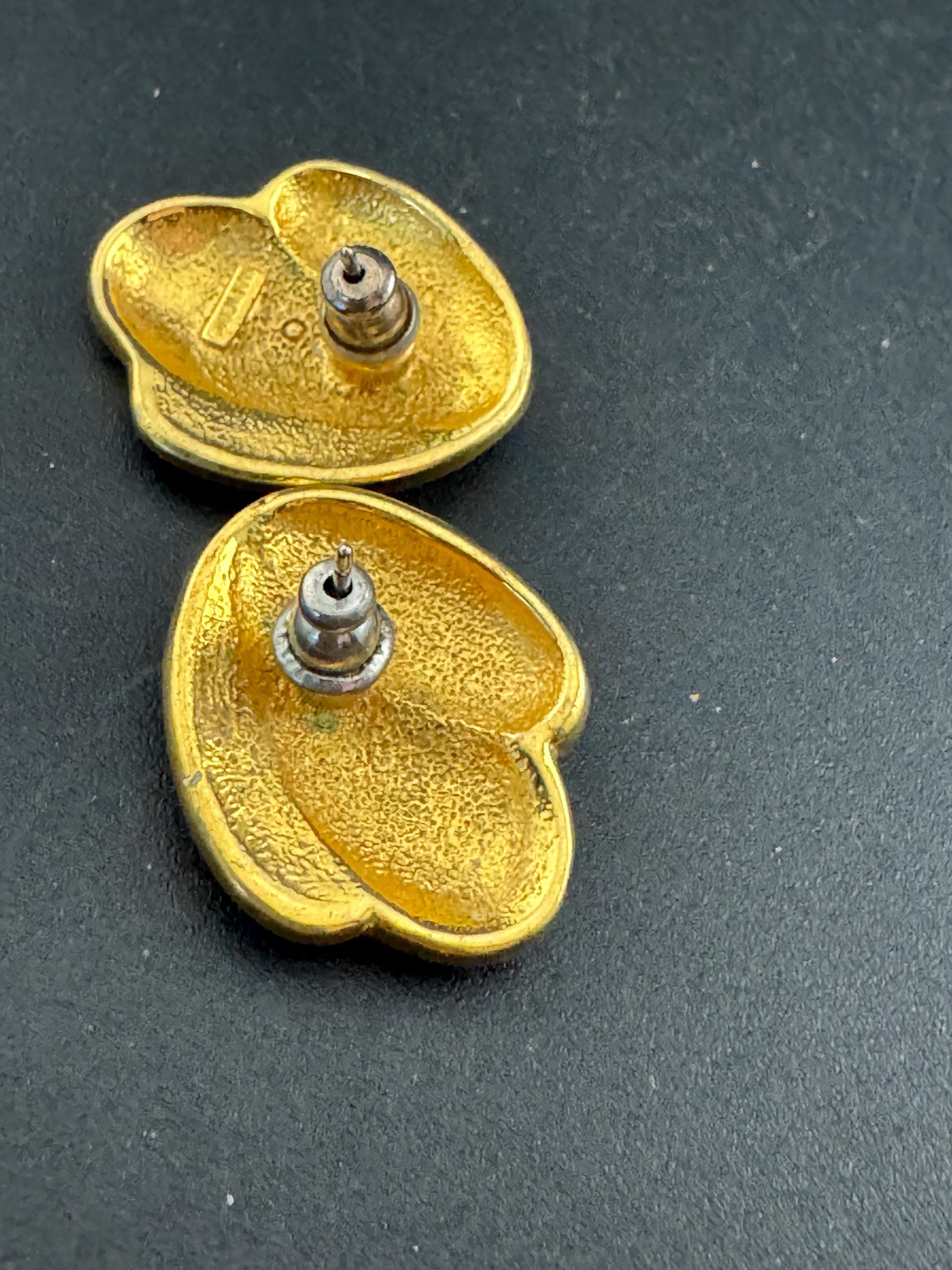 Signed Napier cream enamel pair stud earrings, gold tone pierced