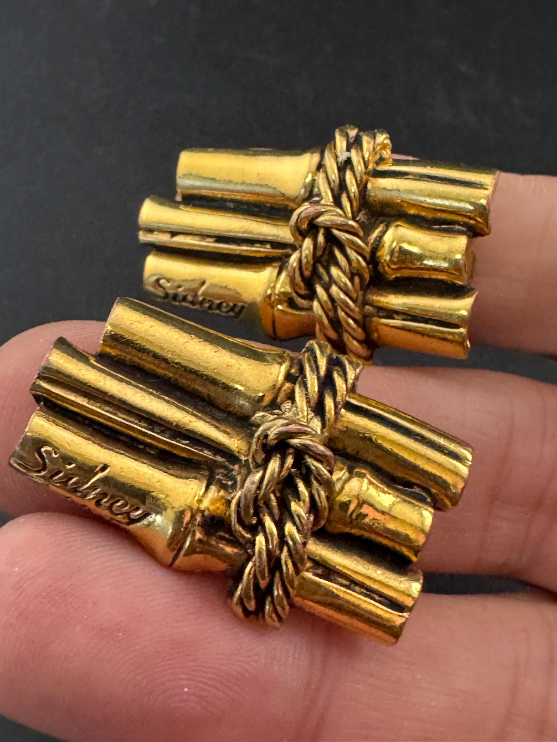 Signed Sidney carron rope twist clip on earrings, designer gold tone
