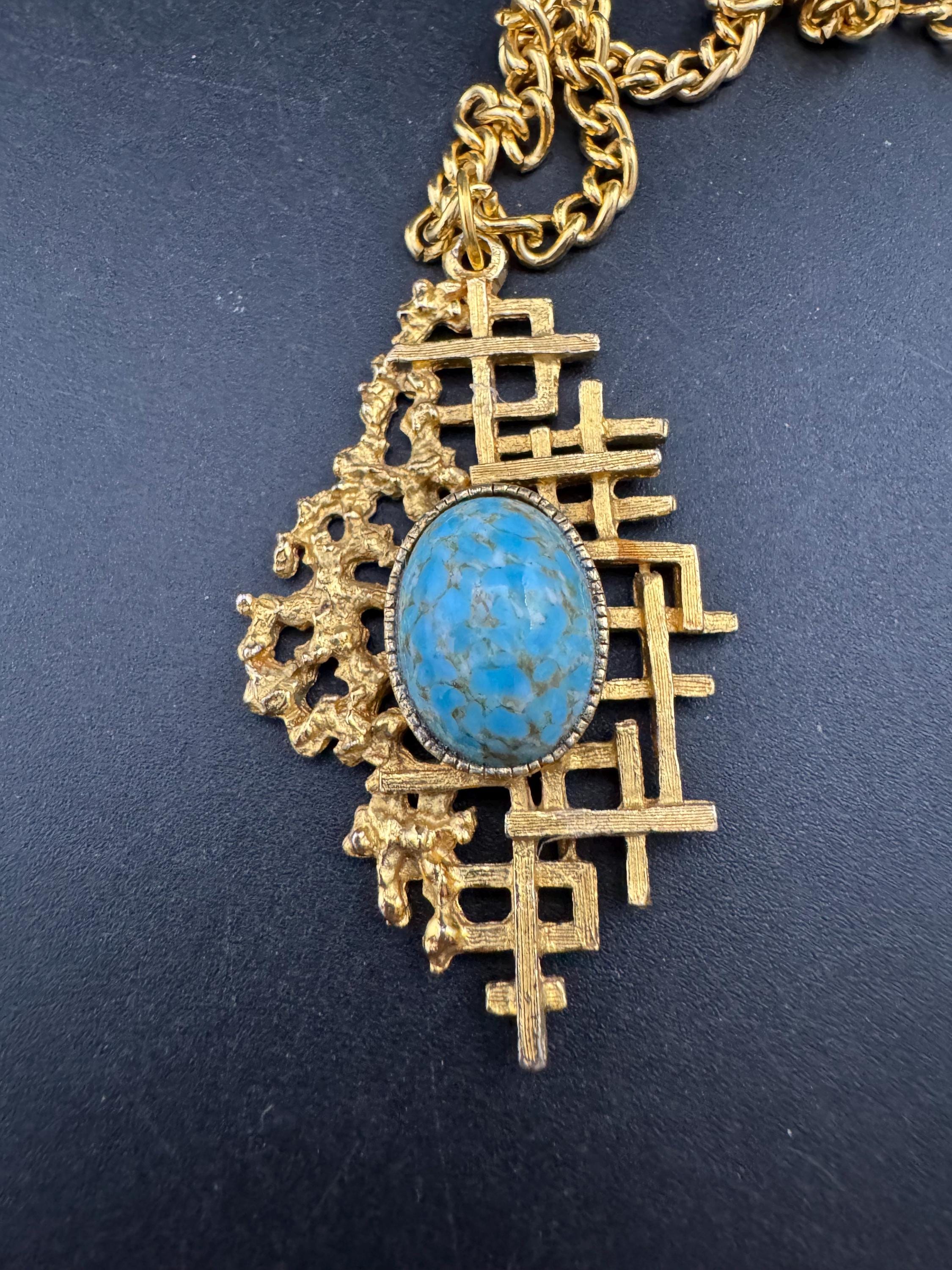 Vintage gold tone brutalist pendant with faux turquoise oval cabochon