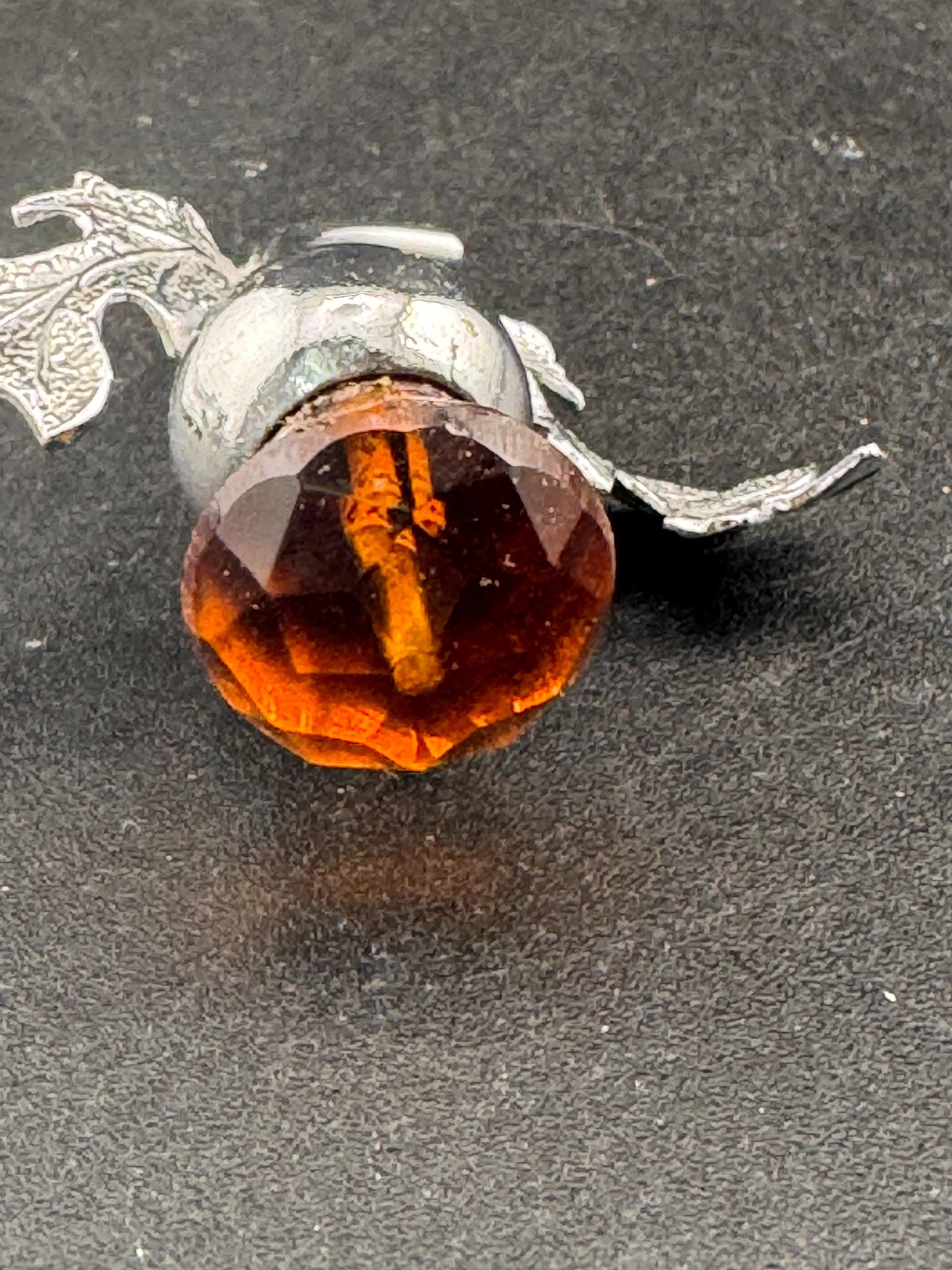 Vintage Scottish thistle brooch set with cut glass citrine flower , silver plated