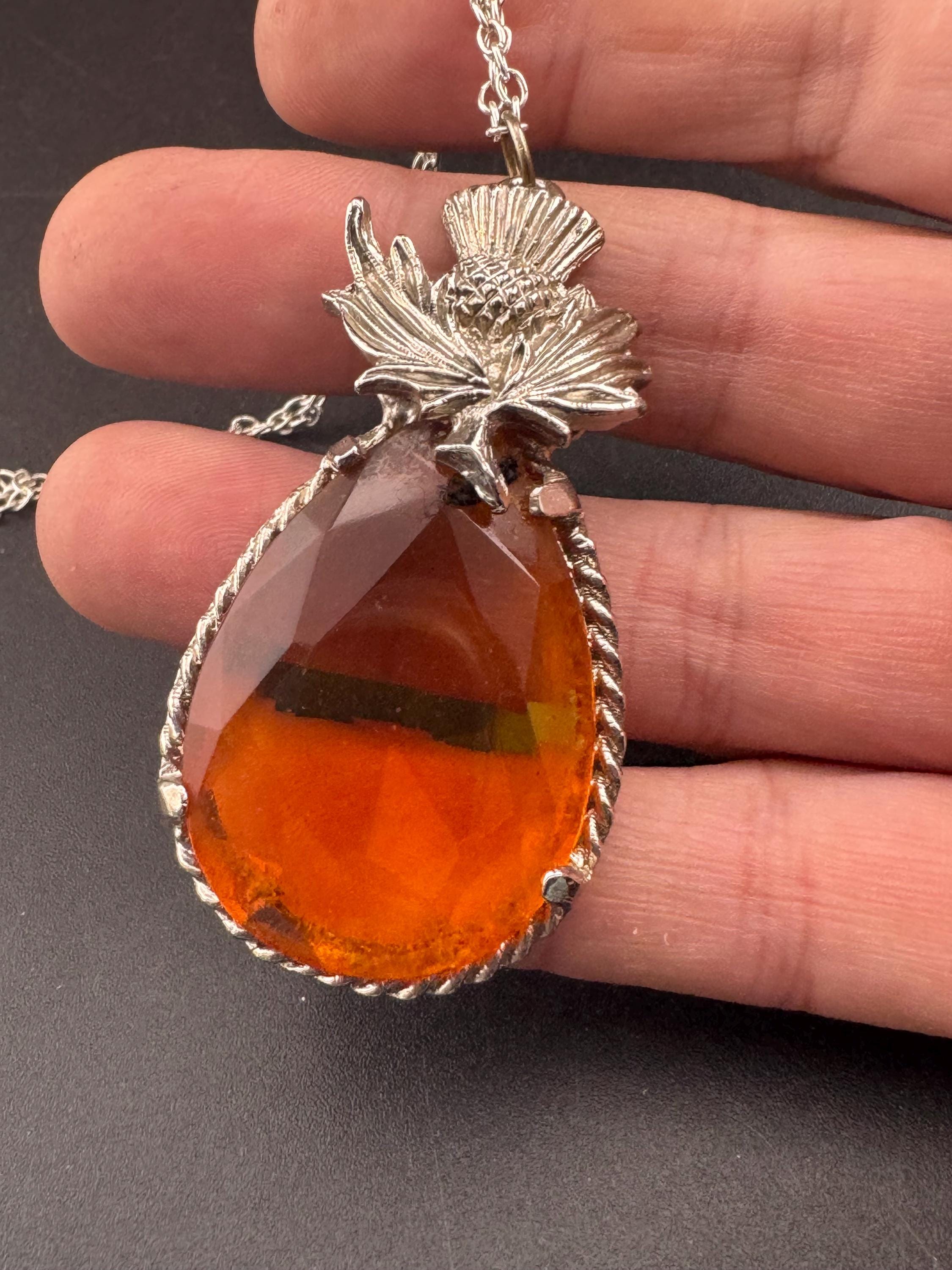 Scottish thistle orange faceted Glass teardrop pendant on 50cm later chain , silver tone