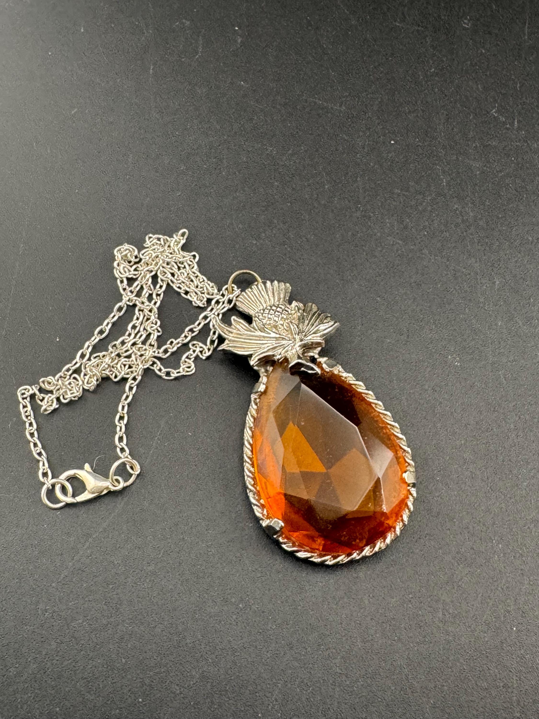 Scottish thistle orange faceted Glass teardrop pendant on 50cm later chain , silver tone