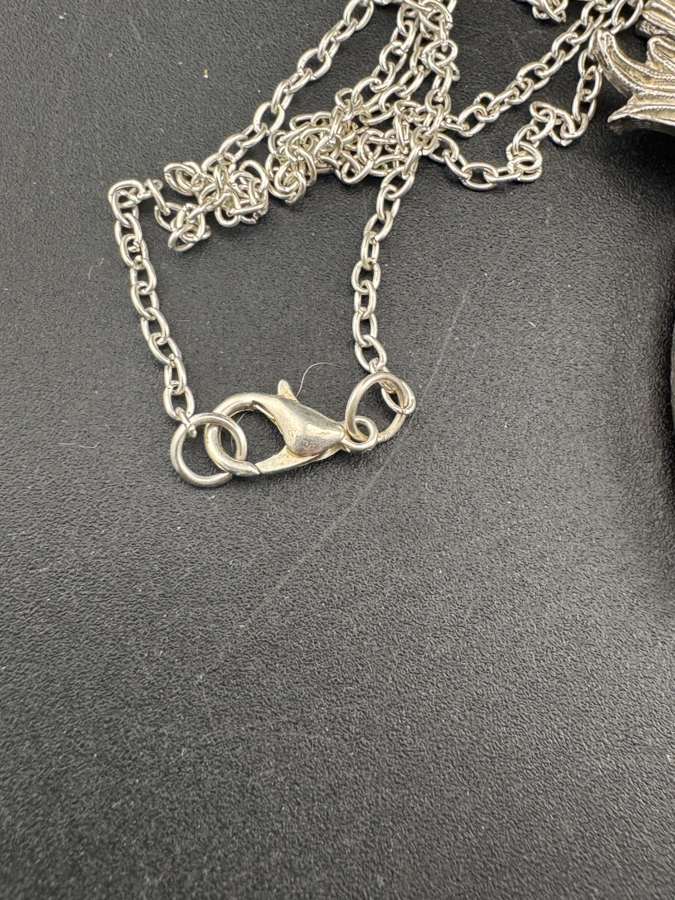 Scottish thistle orange faceted Glass teardrop pendant on 50cm later chain , silver tone