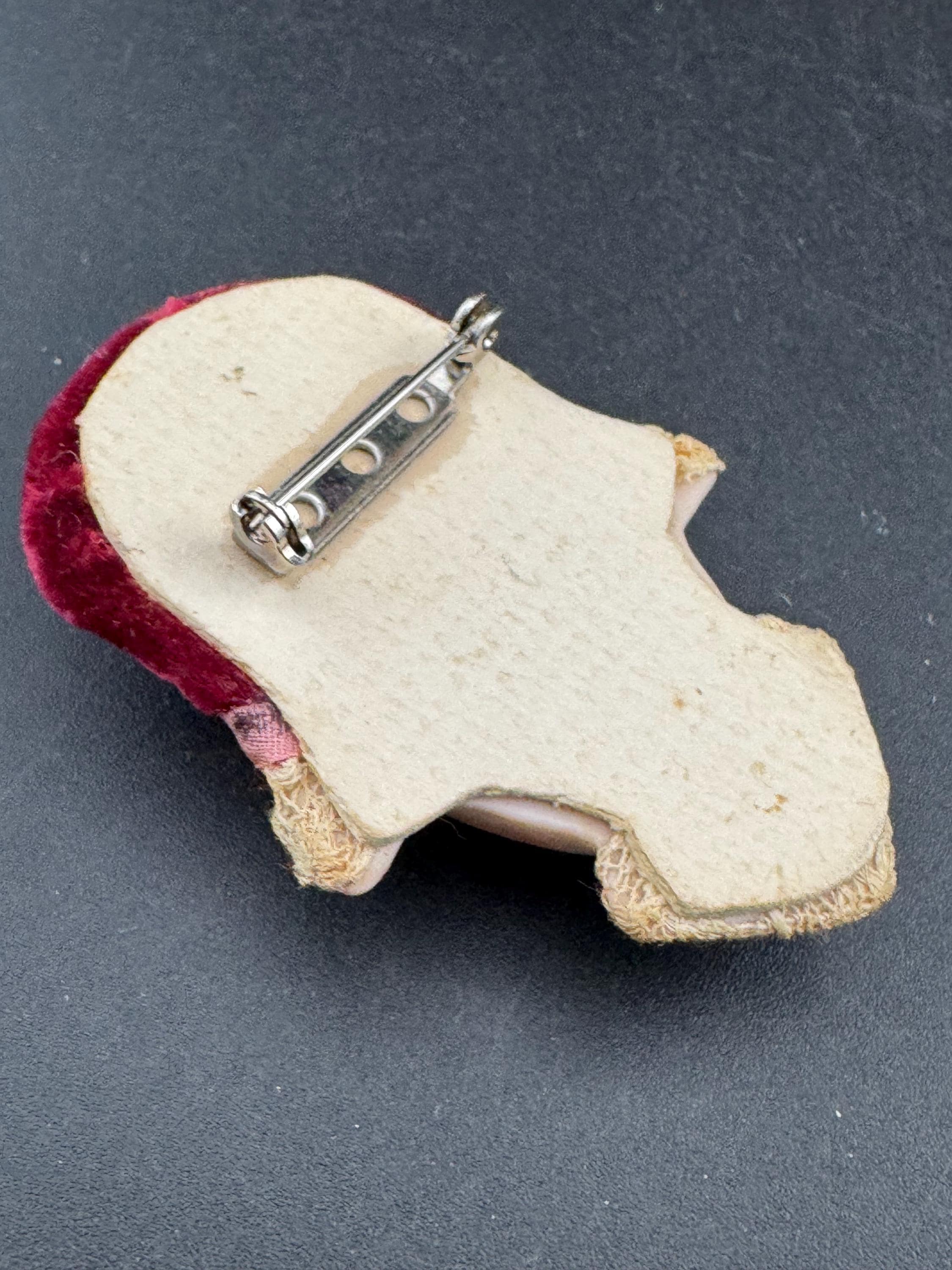 Vintage ceramic flapper face brooch: art deco with red velvet hat