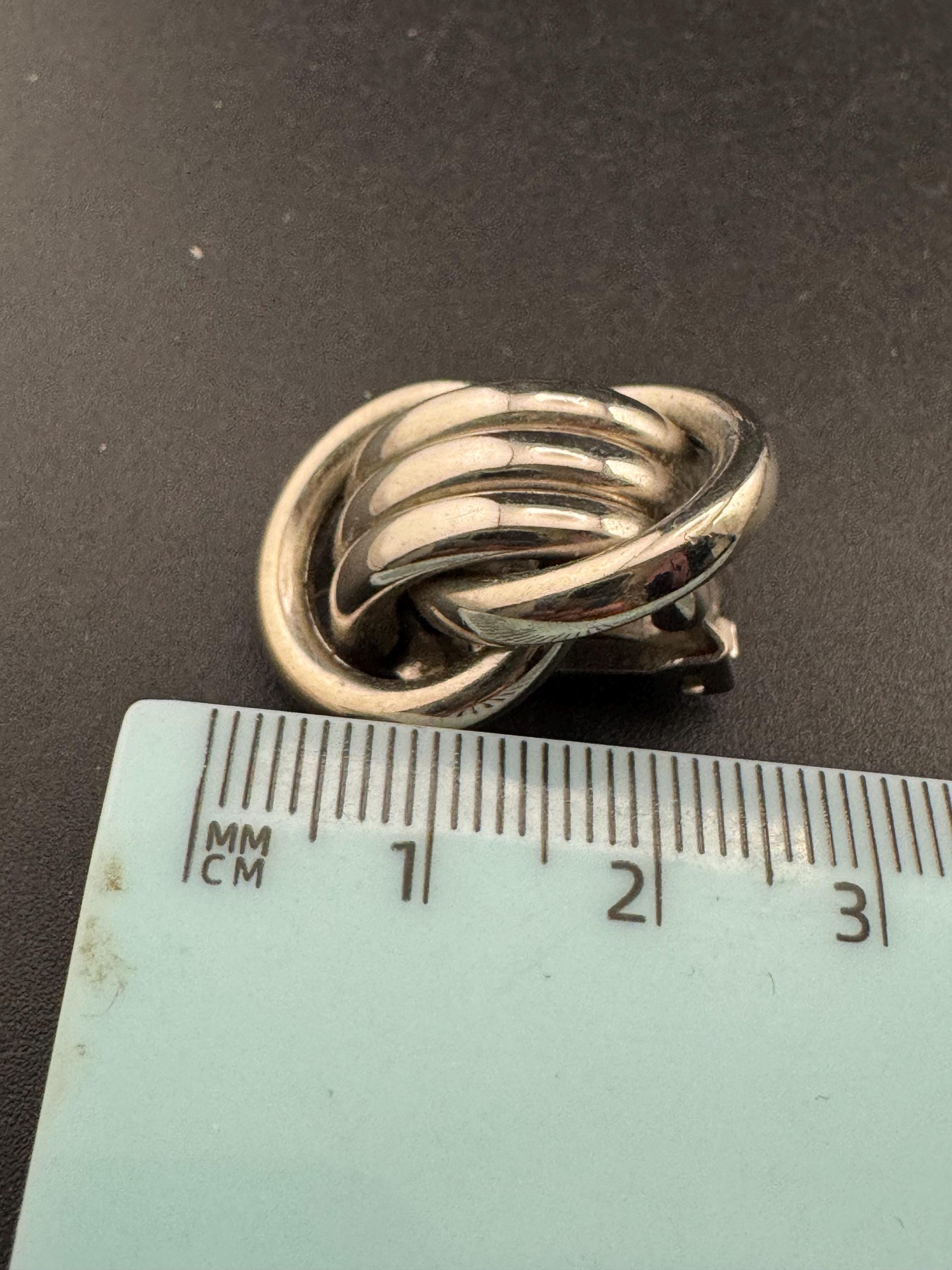 1980s vintage metal tube knot clip on earrings, silver tone