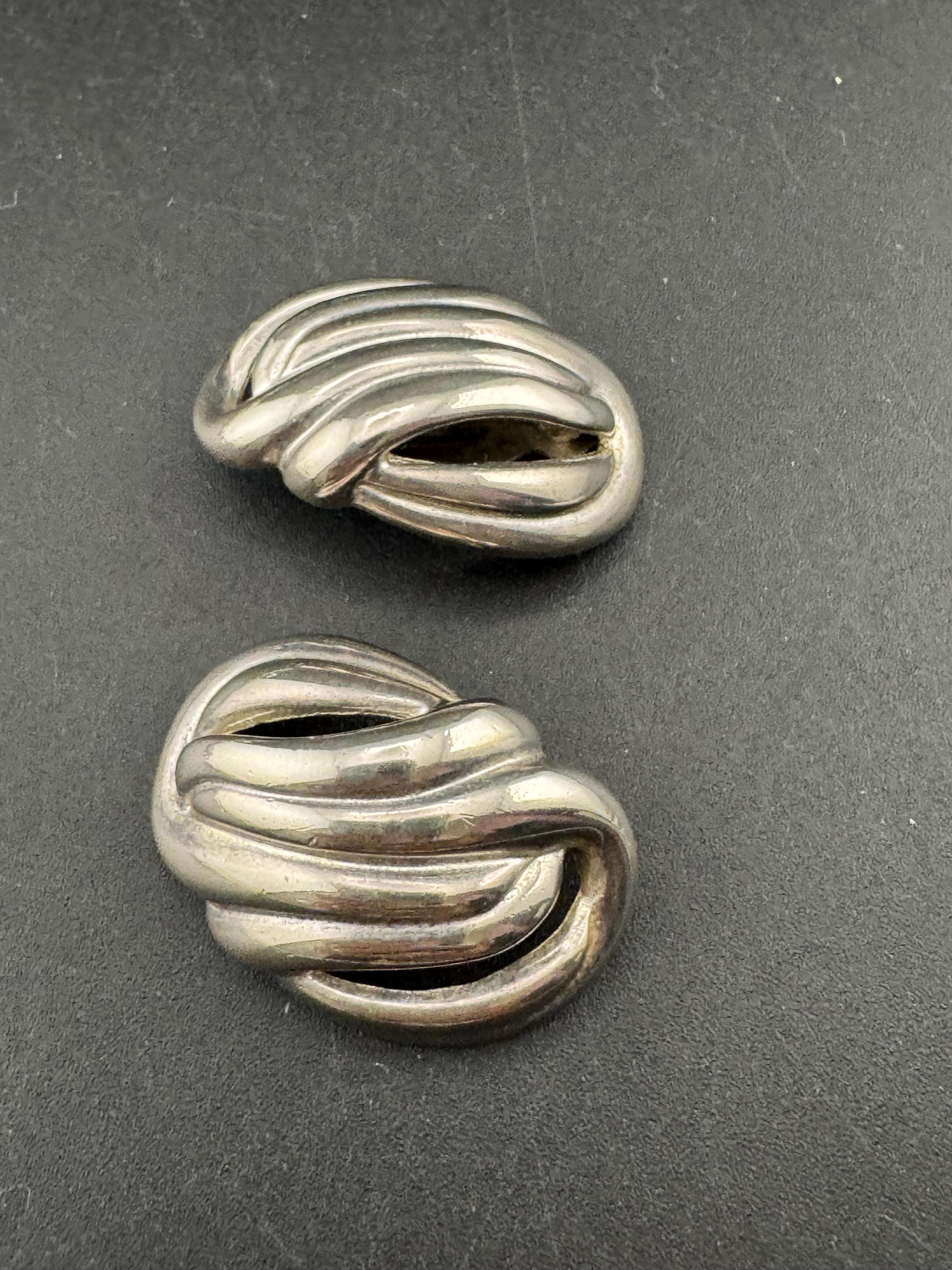 Vintage oversized silver metal swirl clip on earrings, 1980s