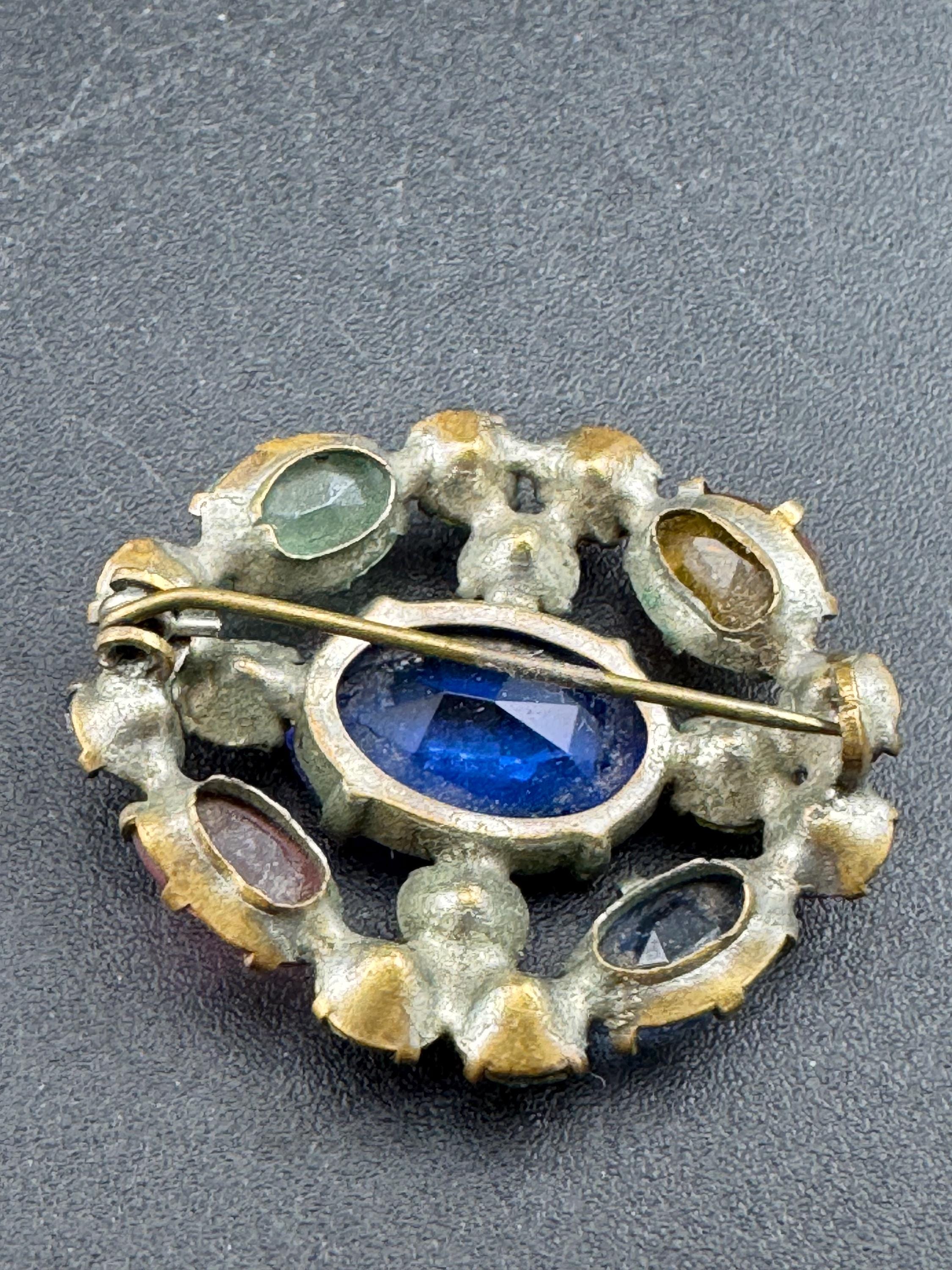 Antique Edwardian gold tone rainbow diamanté crystal oval open back brooch