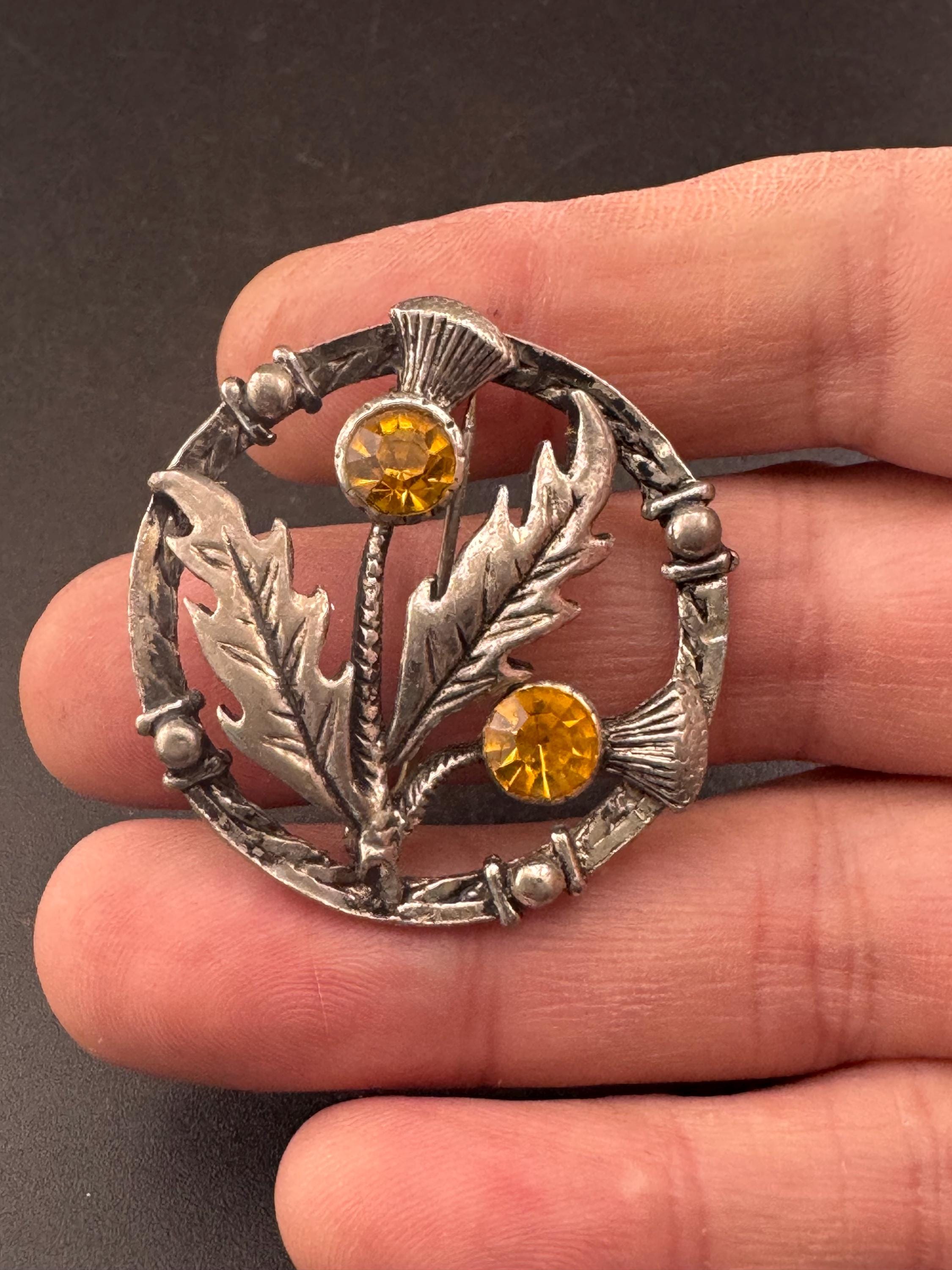 Vintage Scottish thistle brooch set with faux glass citrine, silver tone
