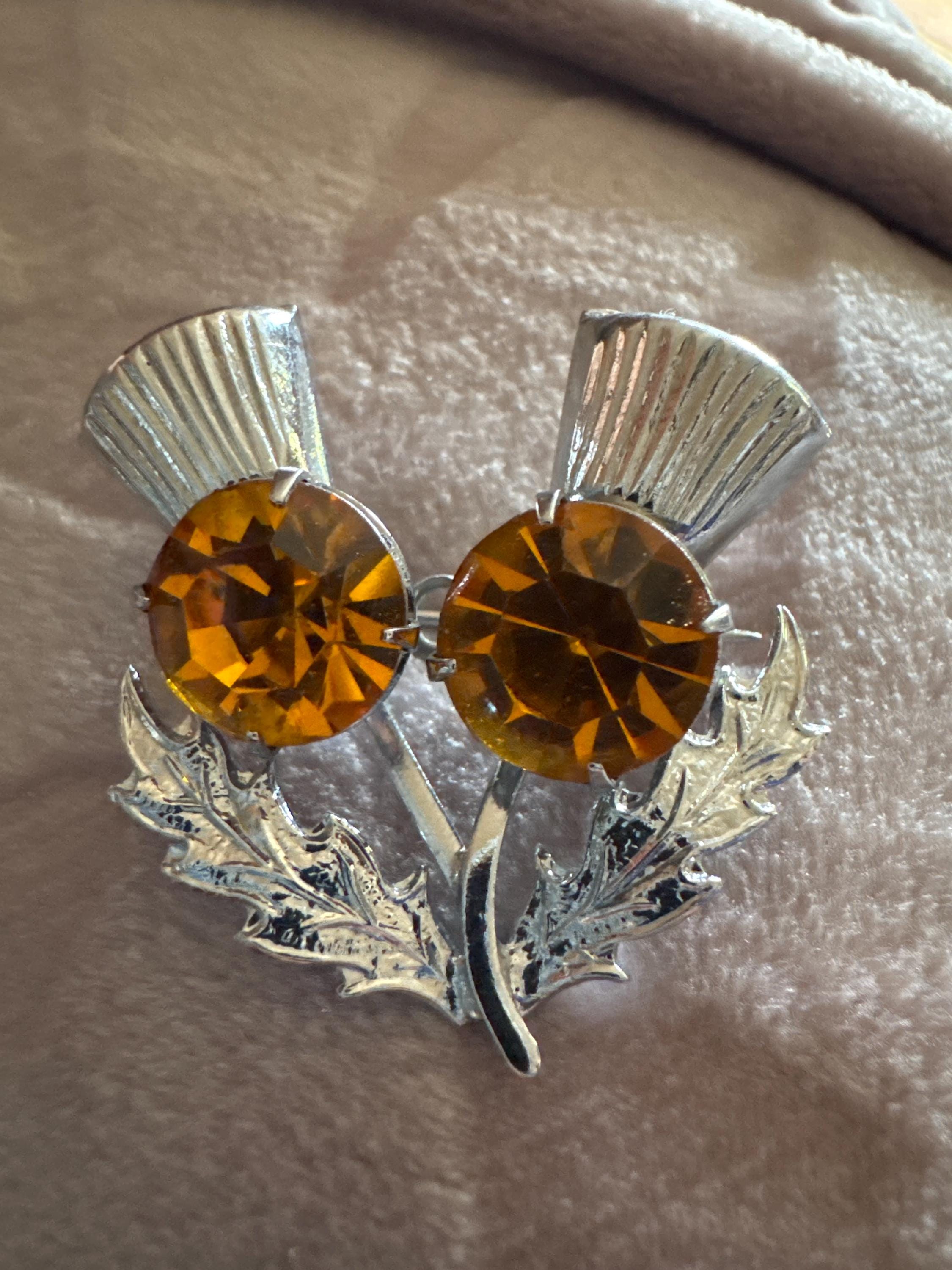 Vintage Scottish thistle brooch set with faux glass citrine, silver chrome metal