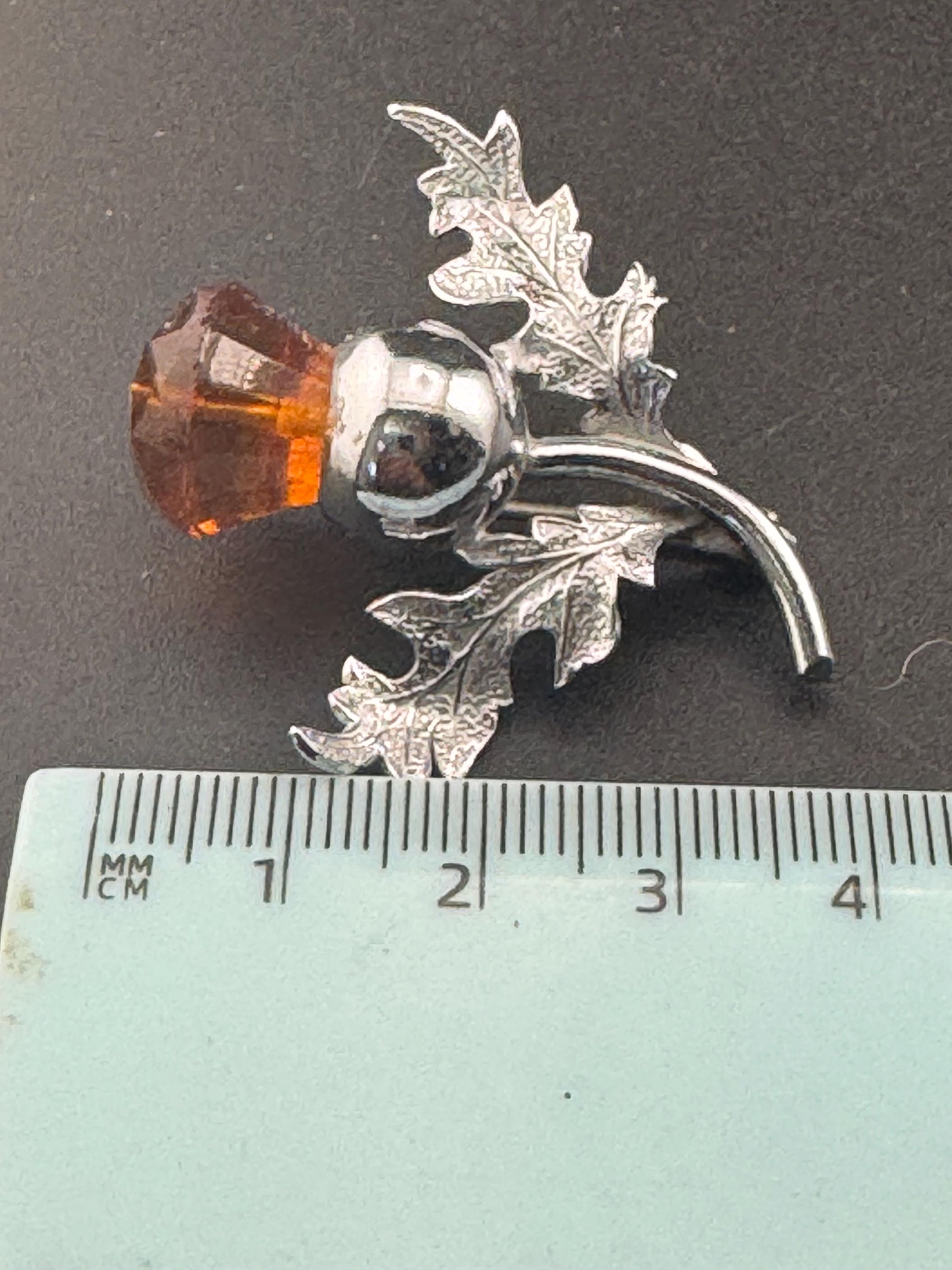 Vintage Scottish thistle brooch set with cut glass citrine flower , silver plated