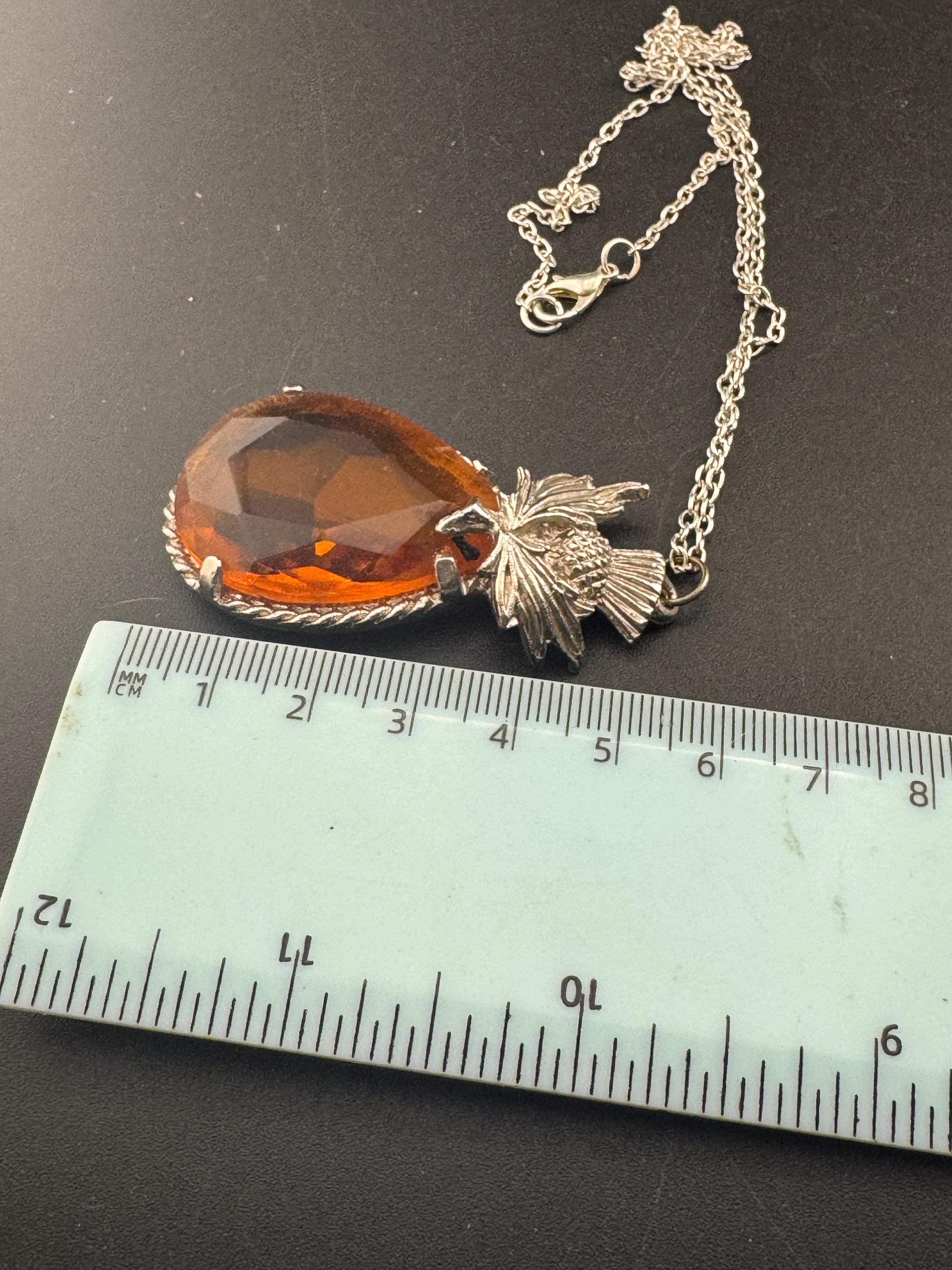 Scottish thistle orange faceted Glass teardrop pendant on 50cm later chain , silver tone