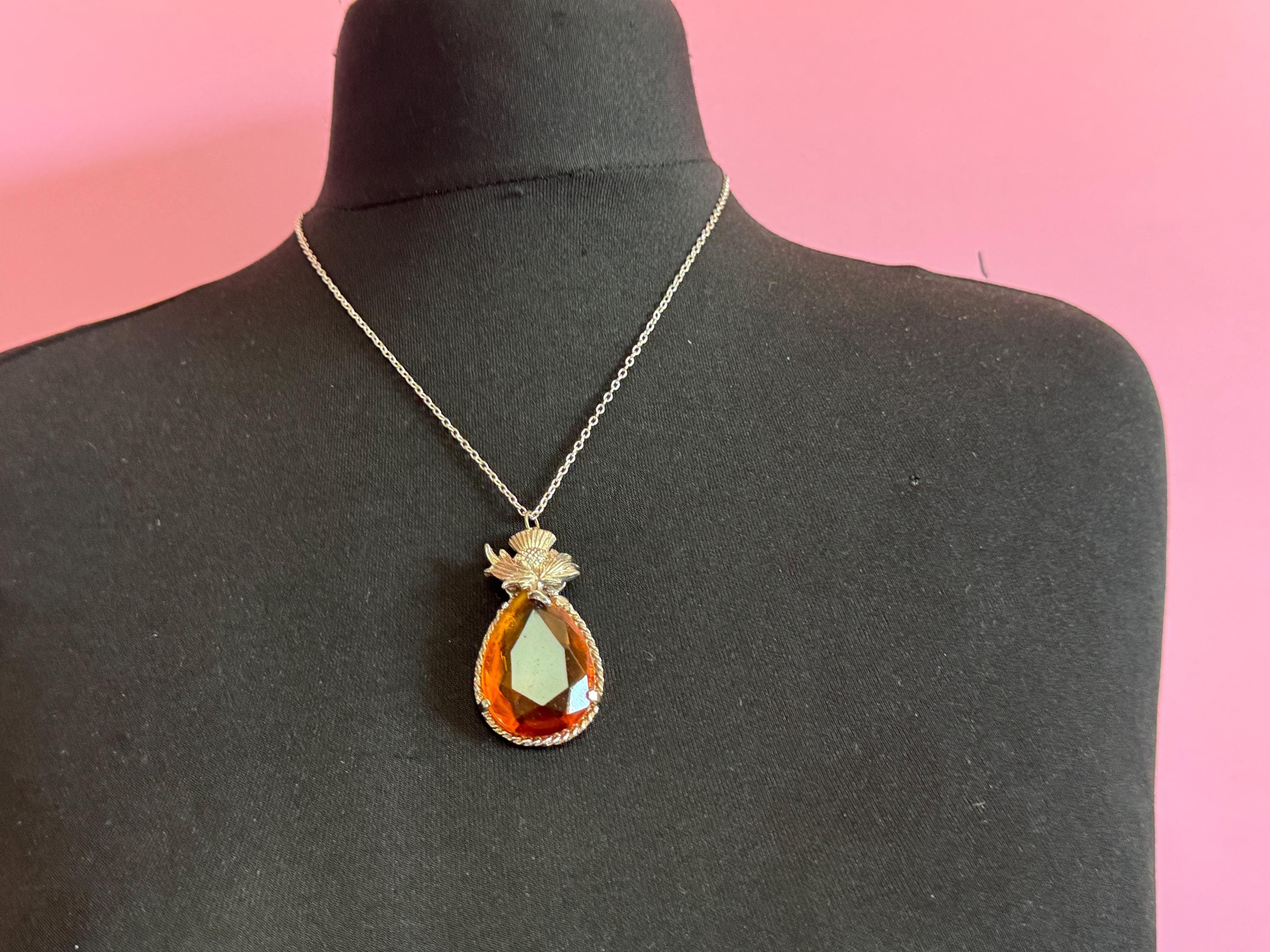 Scottish thistle orange faceted Glass teardrop pendant on 50cm later chain , silver tone