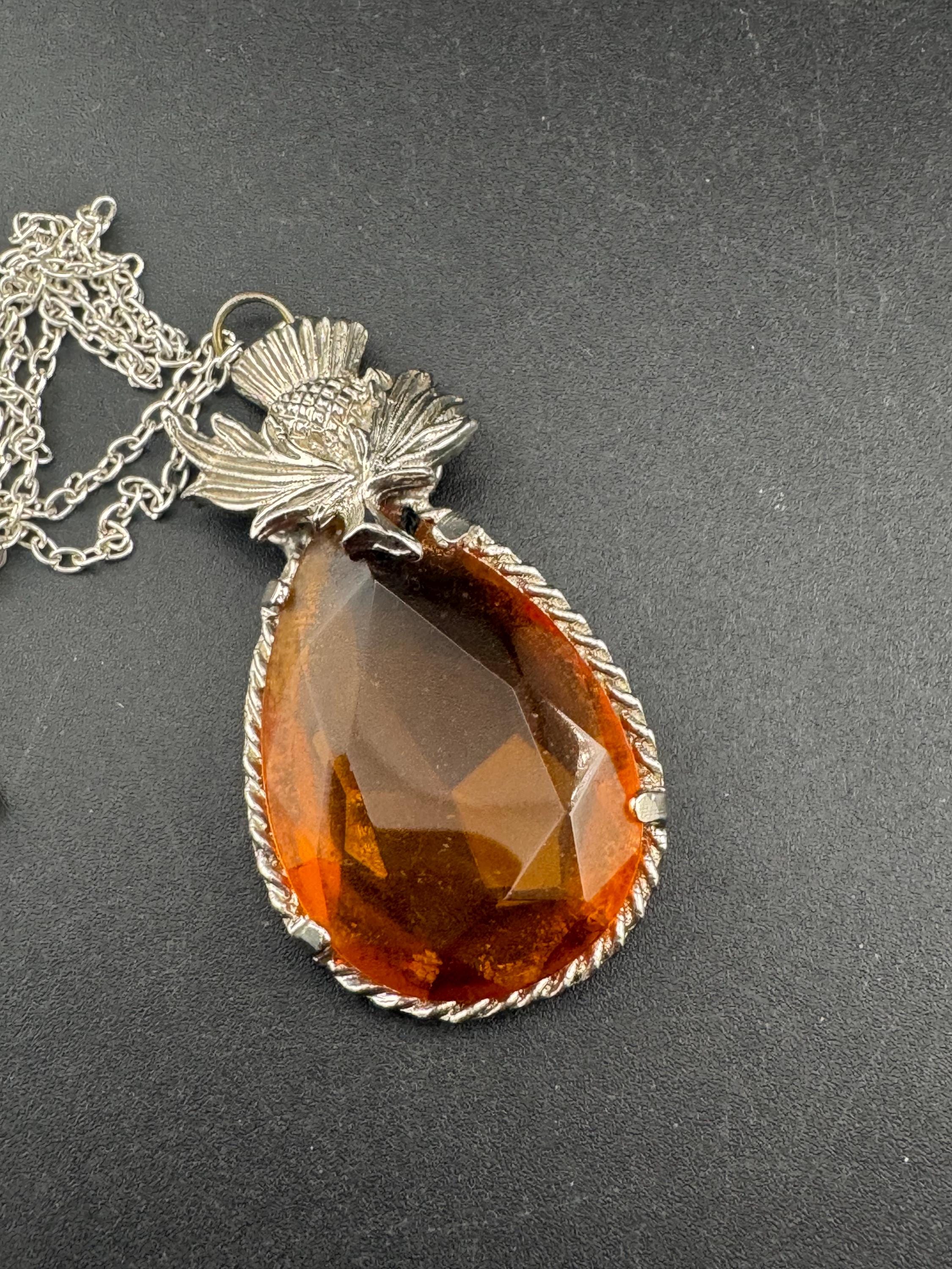 Scottish thistle orange faceted Glass teardrop pendant on 50cm later chain , silver tone
