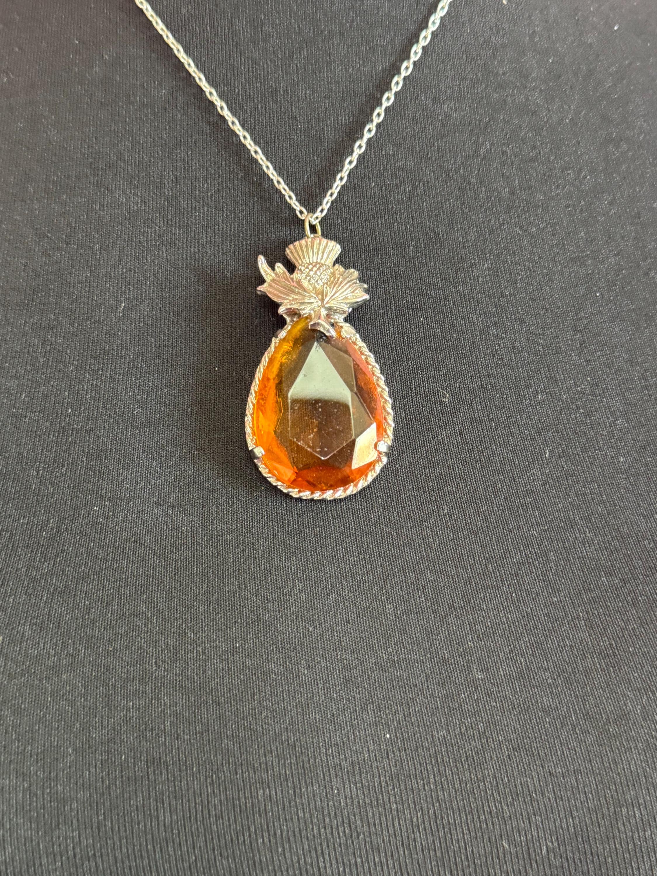 Scottish thistle orange faceted Glass teardrop pendant on 50cm later chain , silver tone