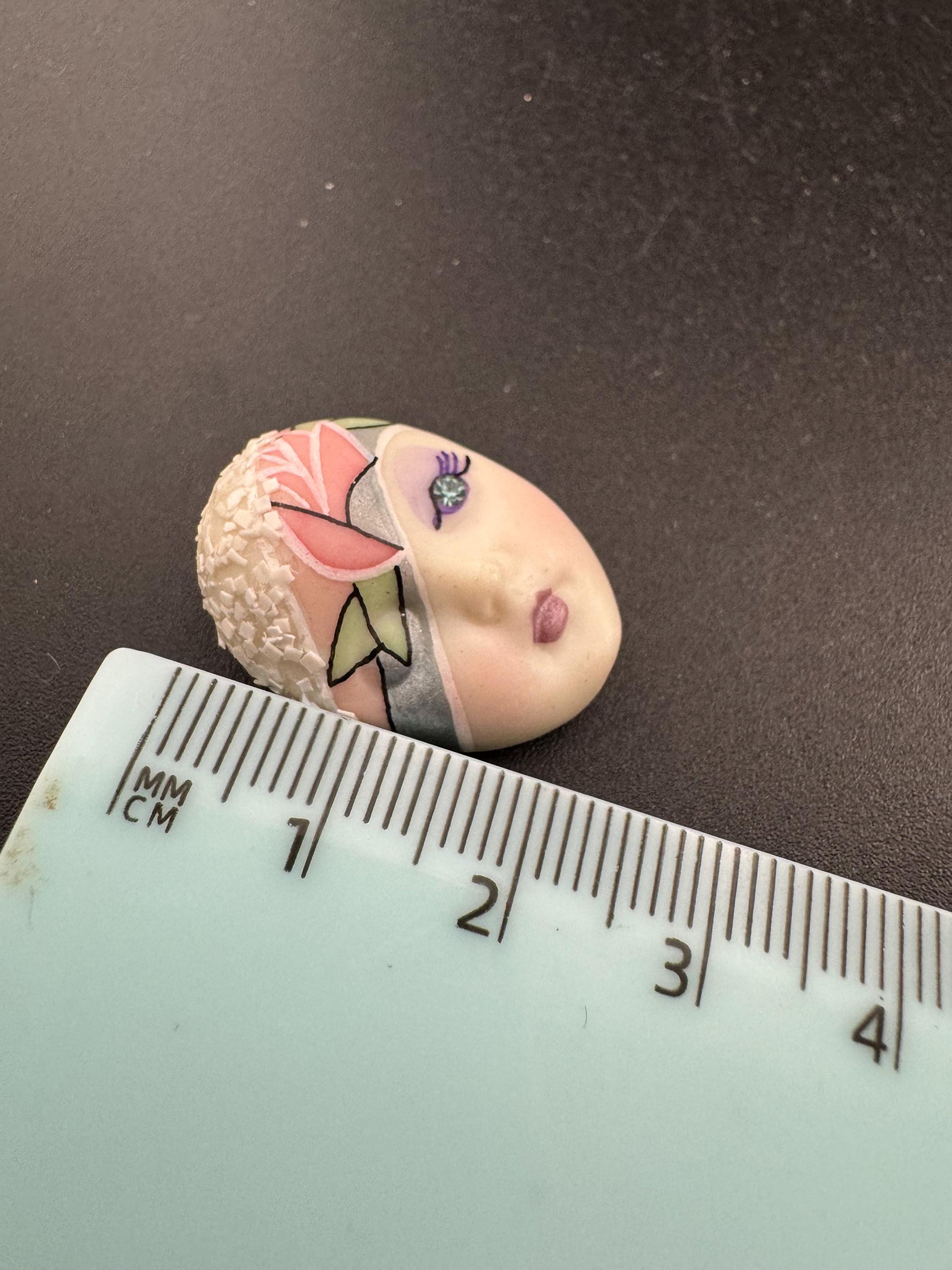 Vintage small signed ceramic flapper face brooch: art deco