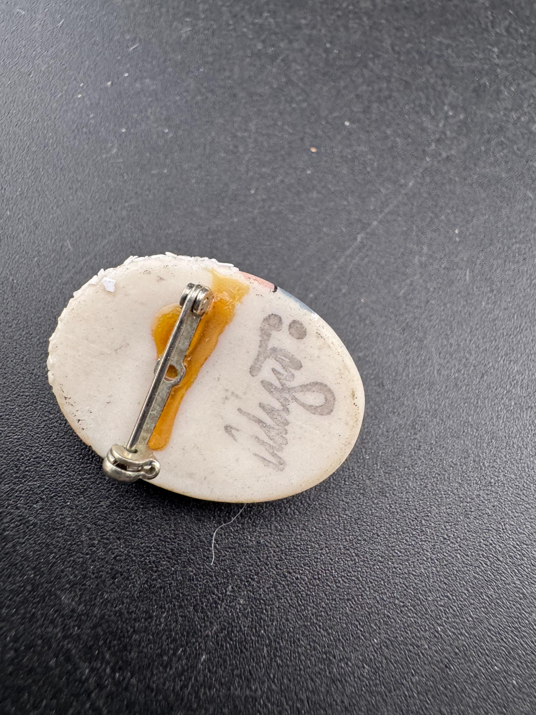 Vintage small signed ceramic flapper face brooch: art deco