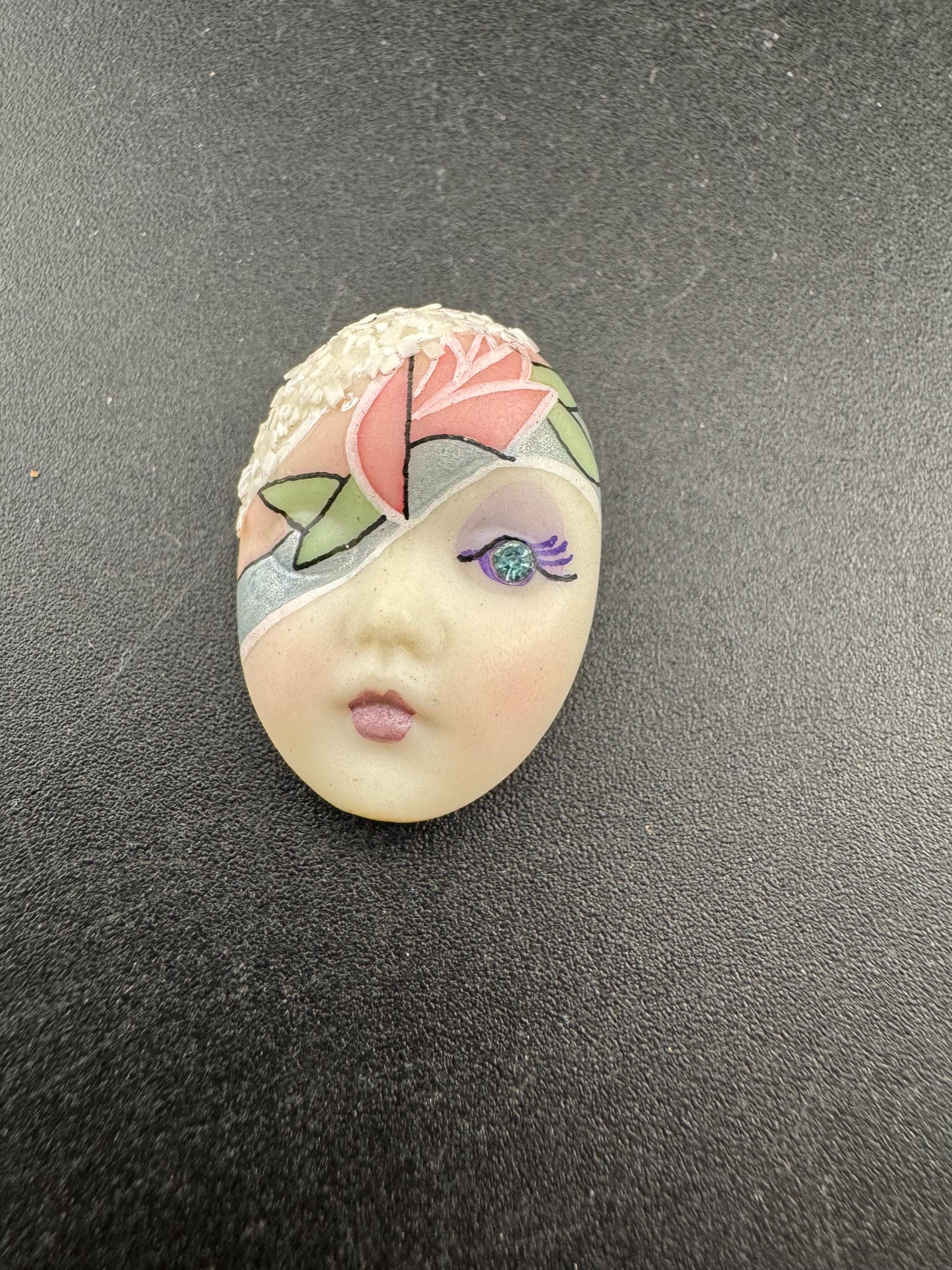 Vintage small signed ceramic flapper face brooch: art deco